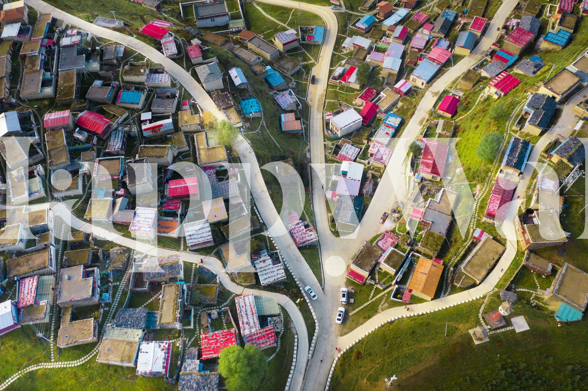 Colorful village landscape with red and white houses wallpaper