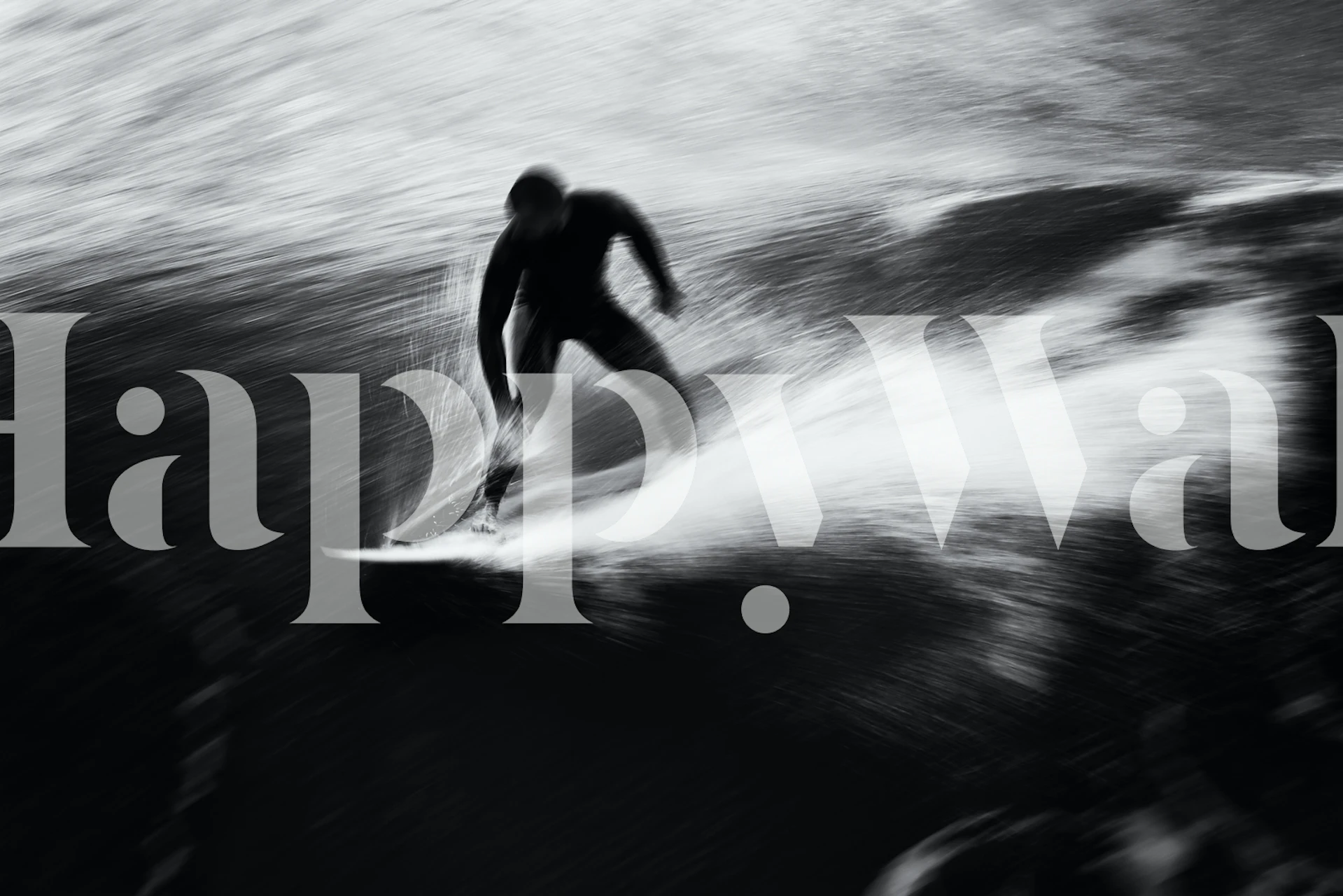 Silhouette d'un surfeur chevauchant une vague dans une décoration murale en noir et blanc