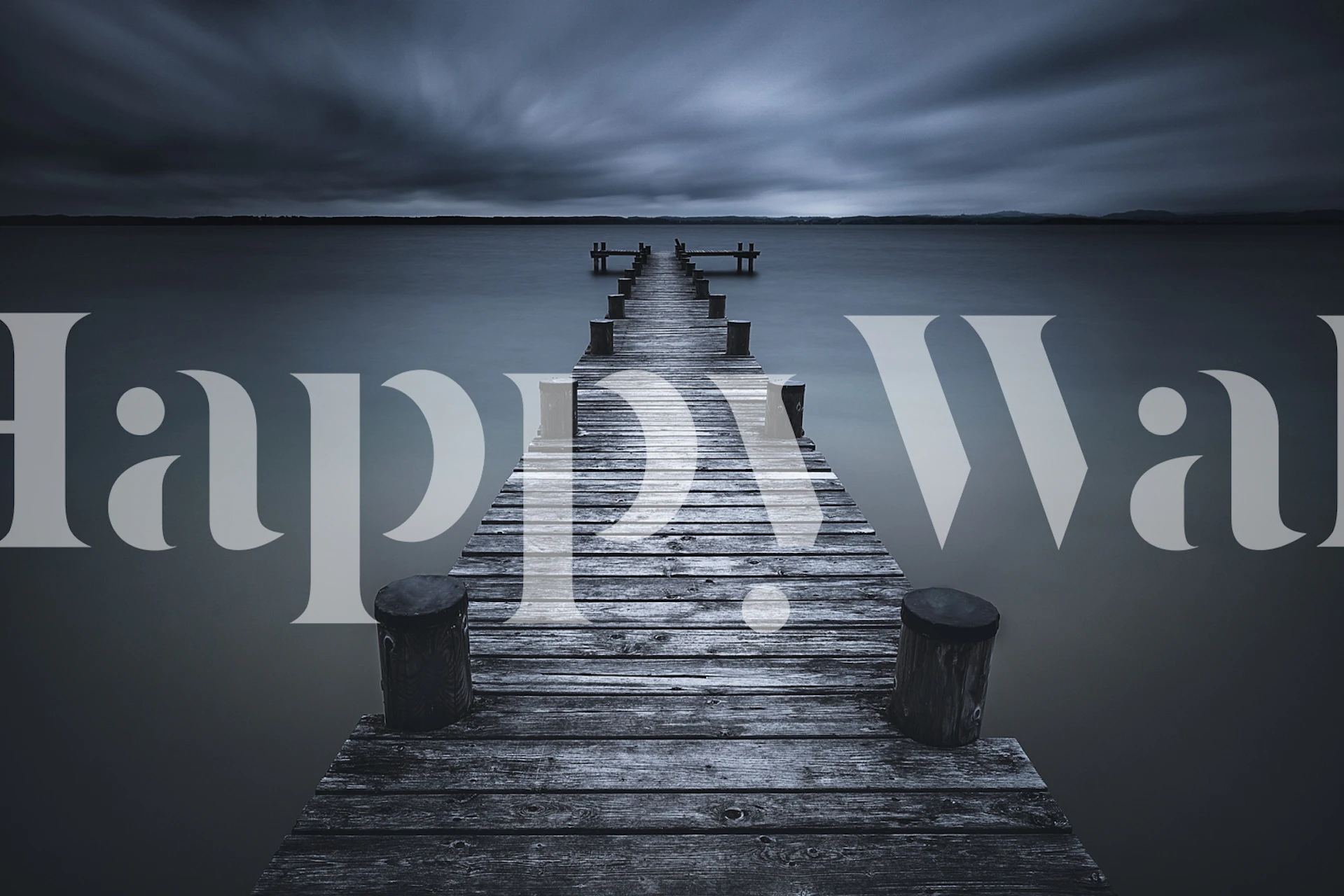 Wooden pier over calm water with gray skies wallpaper