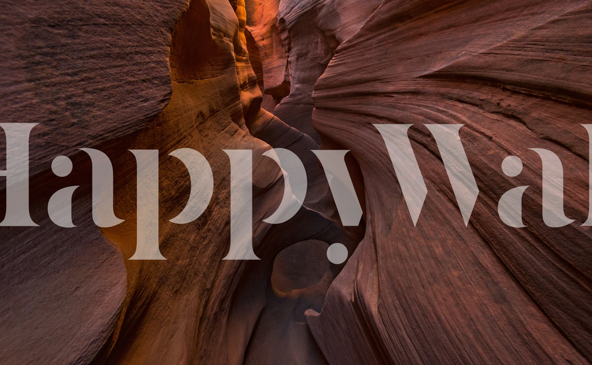 Red canyon walls with smooth curving shapes and warm colors wallpaper