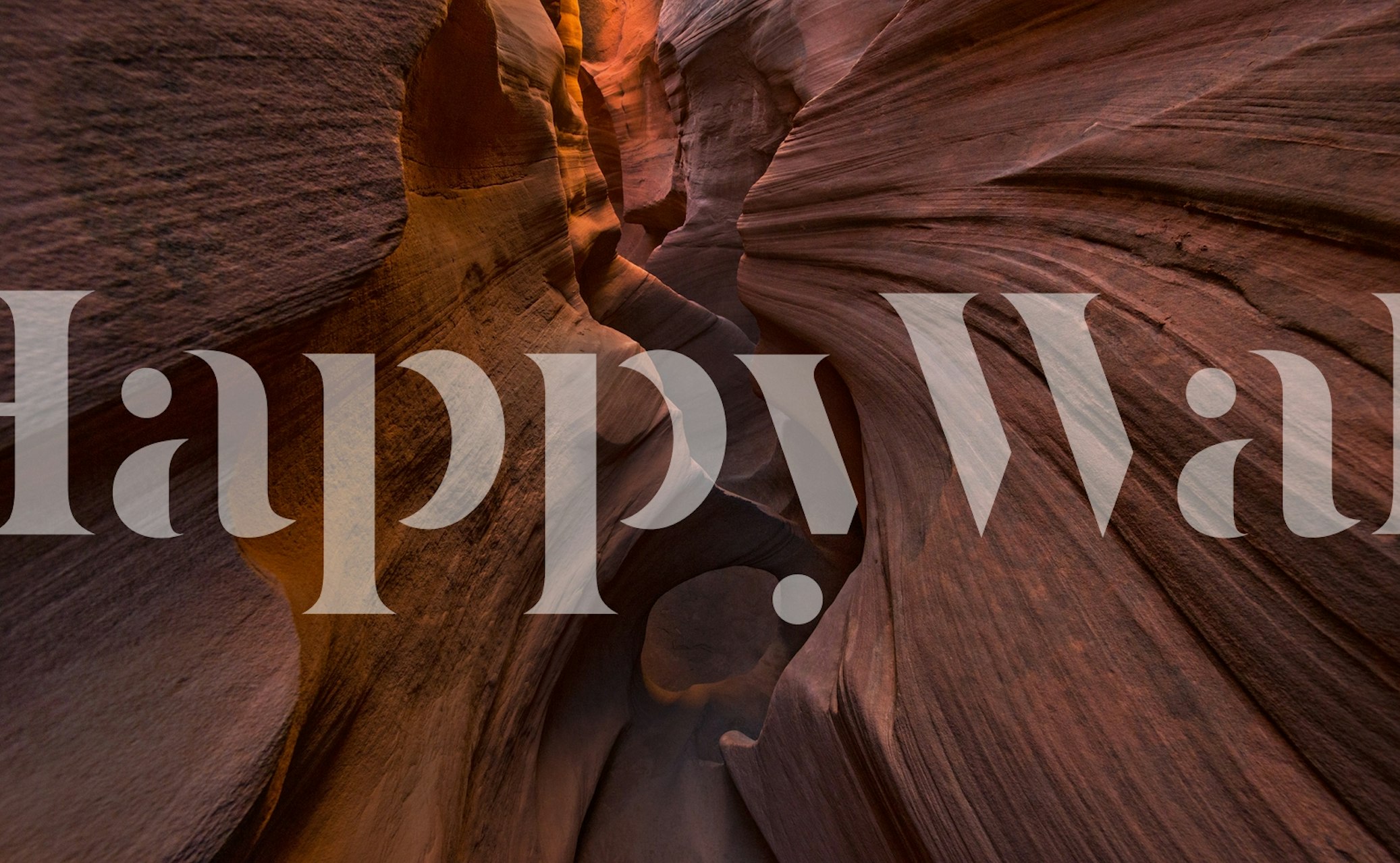 Red canyon walls with smooth curving shapes and warm colors wallpaper