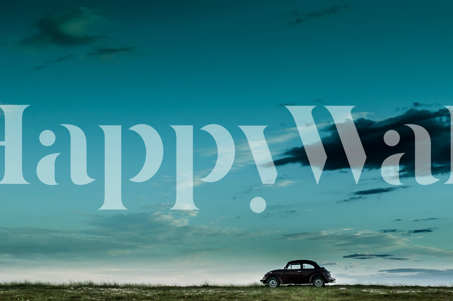 Red VW Beetle car silhouette against an ocean blue sky wallpaper