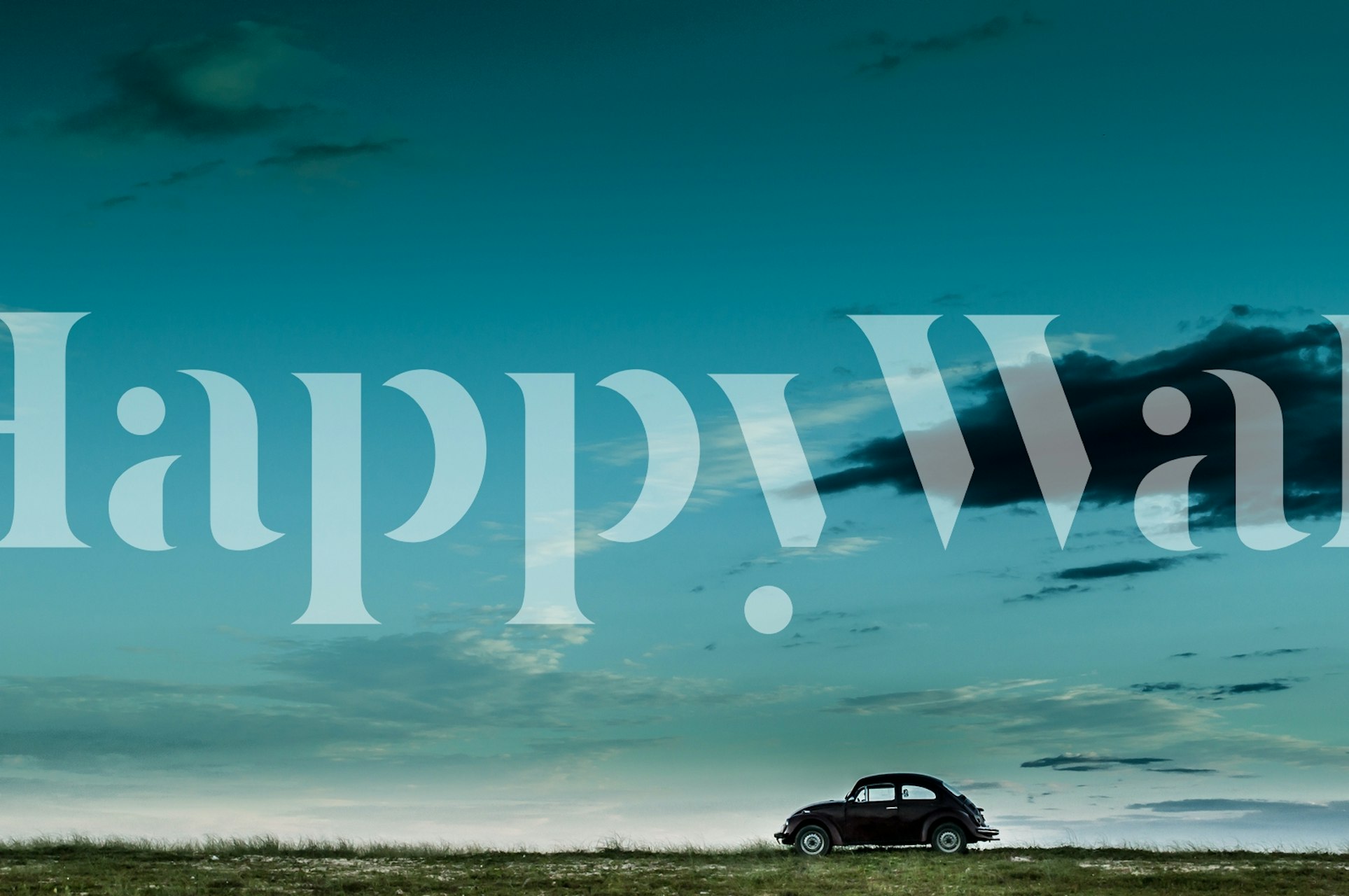 Fotomural VW Beetle rojo con cielo azul y campo abierto