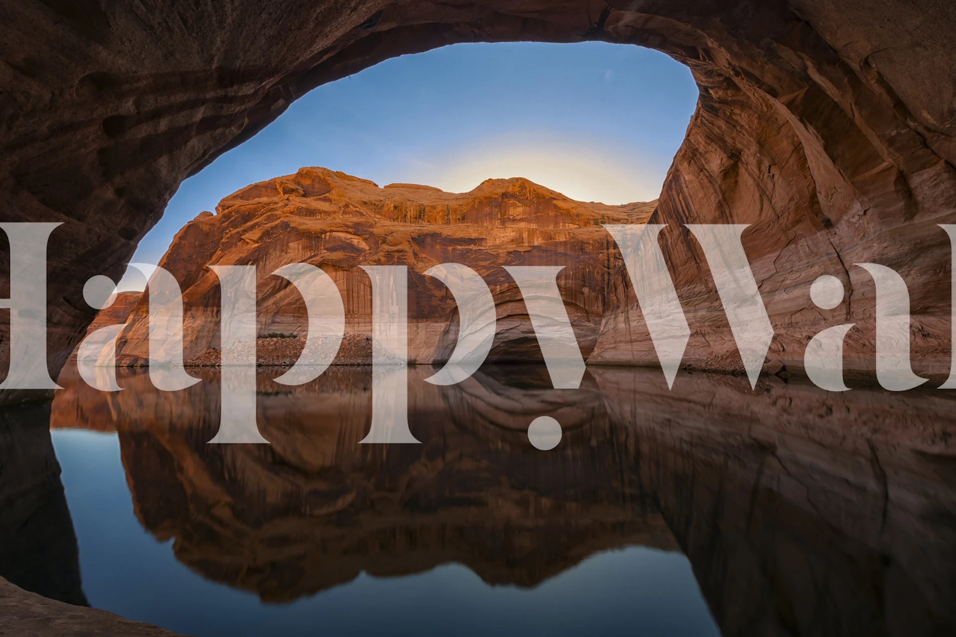 Desert rock formations reflecting in calm water at sunset wallpaper