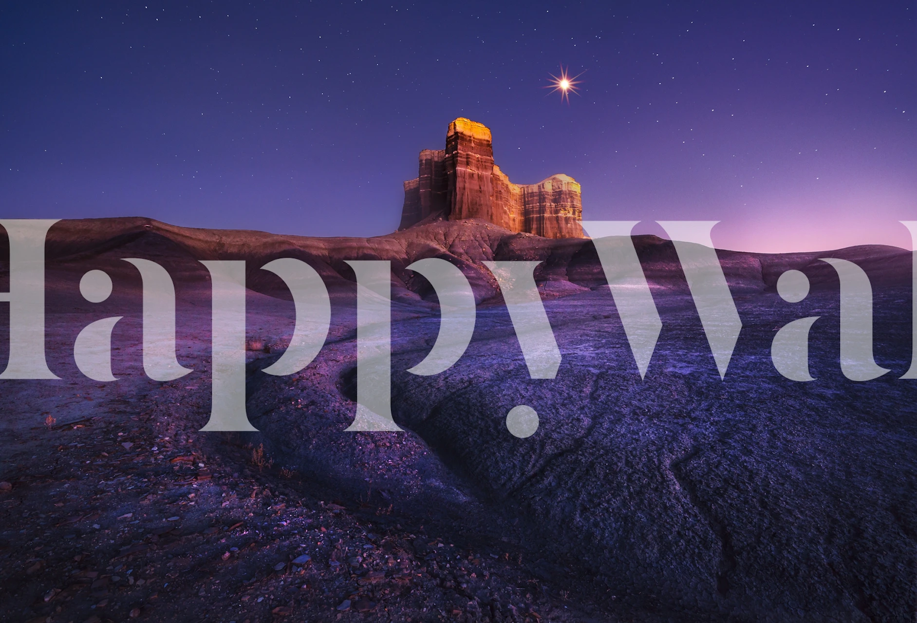 Purple desert landscape with rocky formations and starry sky wallpaper