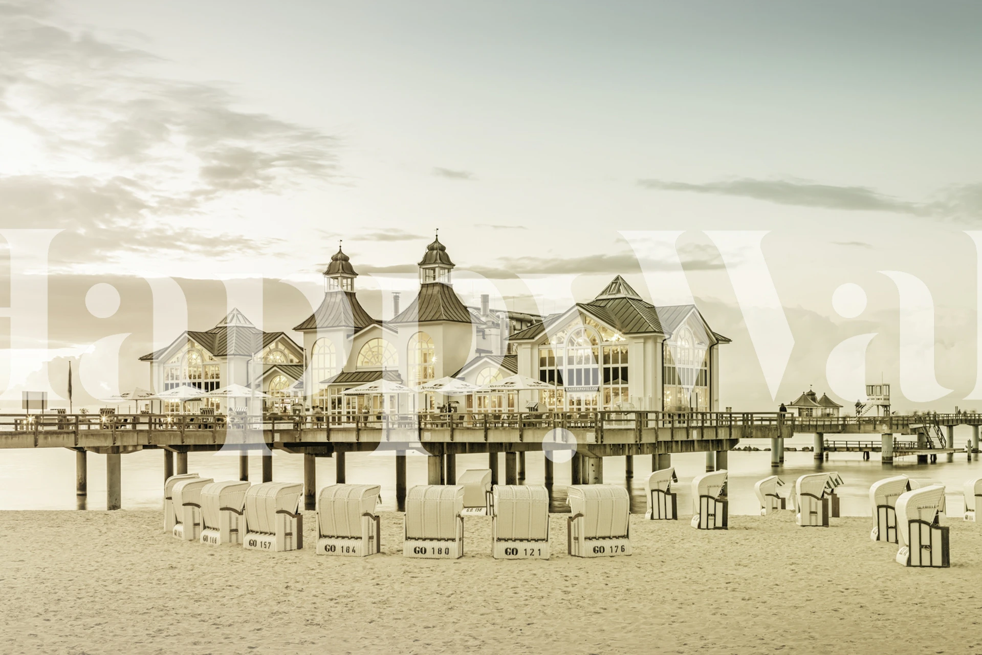 Historic Sellin Pier at sunset with beach chairs on the Baltic Sea wall mural