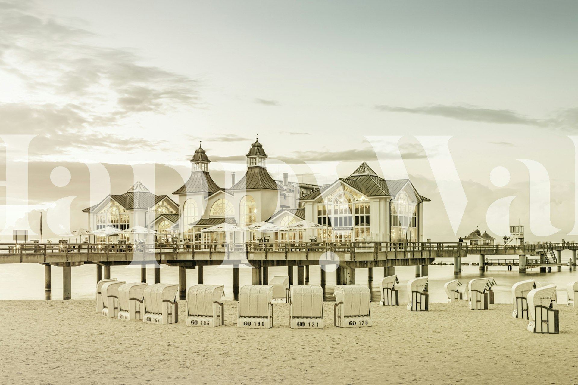 Historic Sellin Pier at sunset with beach chairs on the Baltic Sea wall mural