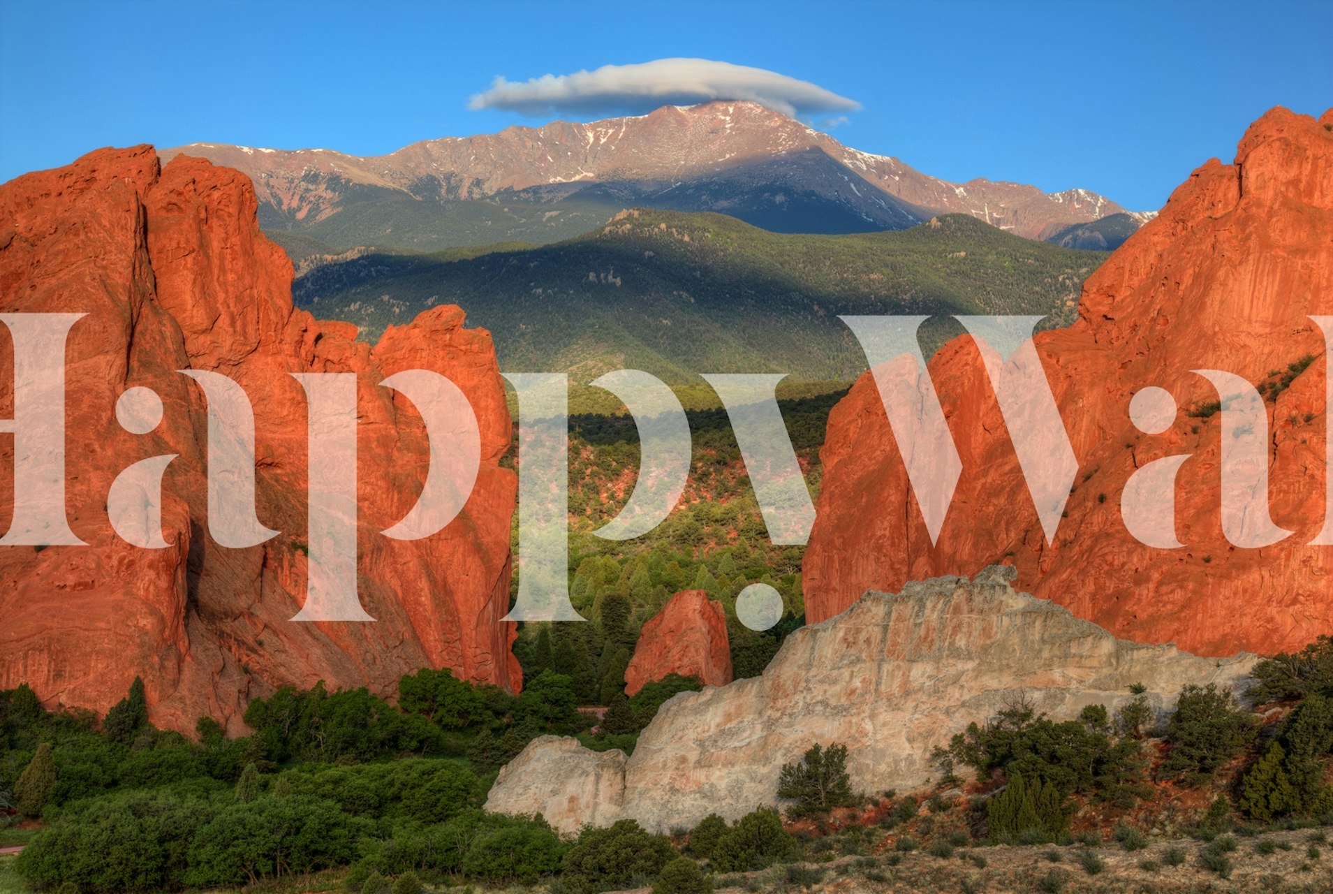 Red mountain landscape with blue sky and green trees wallpaper