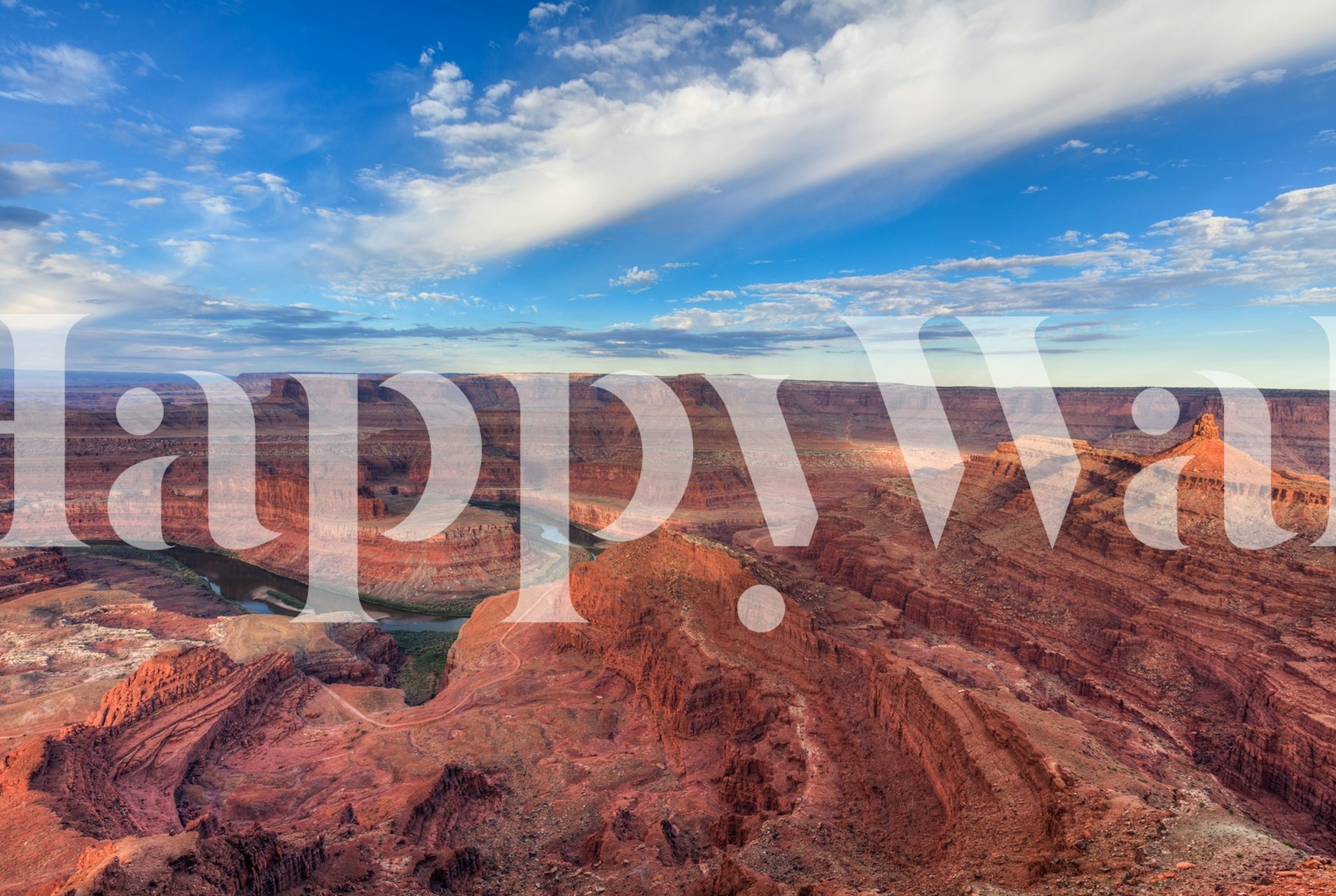 Geometric canyon view with red rock formations and blue sky wallpaper