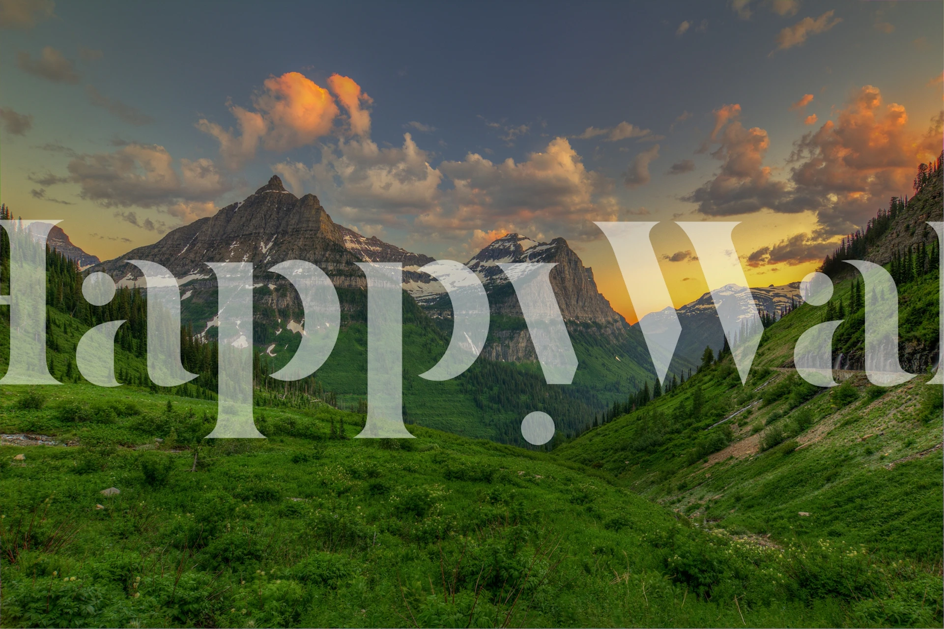 Mountain sunset with orange clouds and green valleys wallpaper
