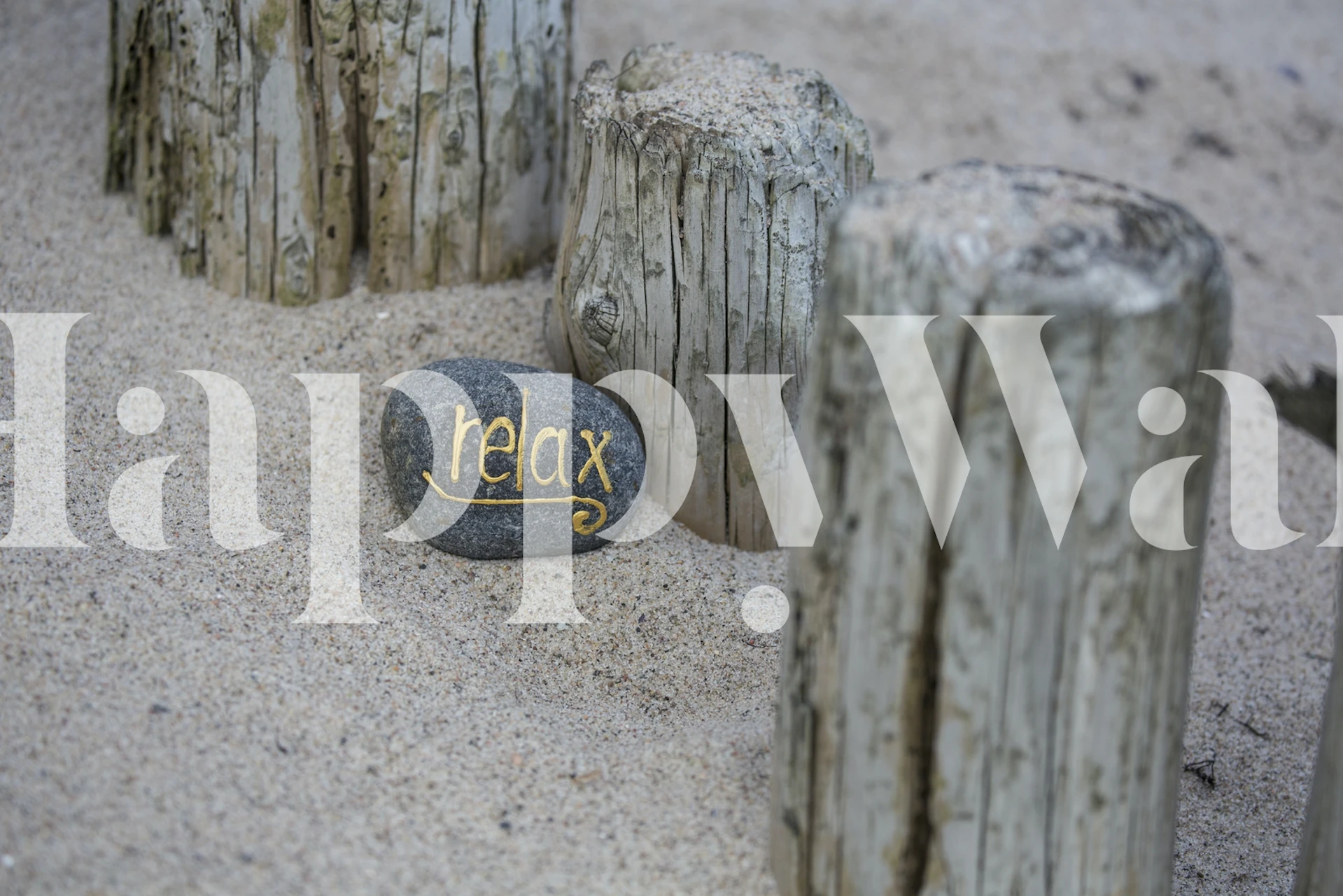 Relax stone in sand with wooden posts wallpaper