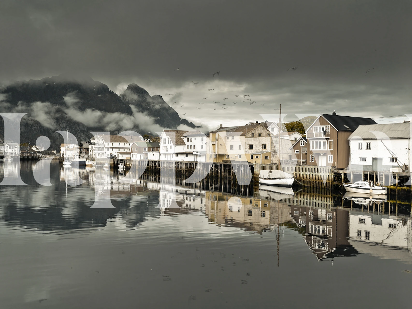 Sepia-toned village landscape with houses and water wallpaper