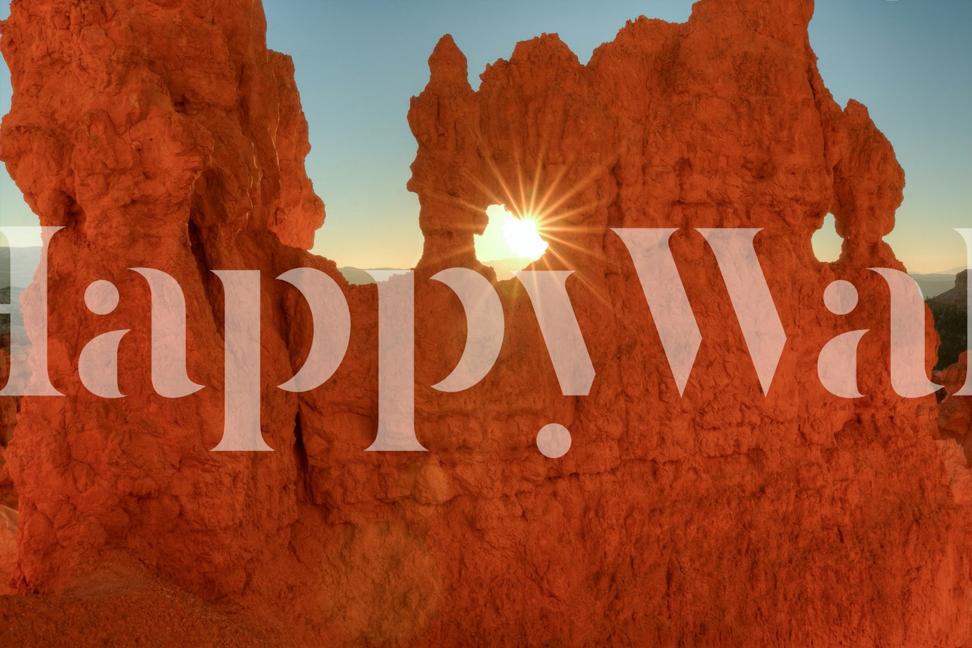 Red rock formations with sunlight shining through a hole, orange tones wallpaper