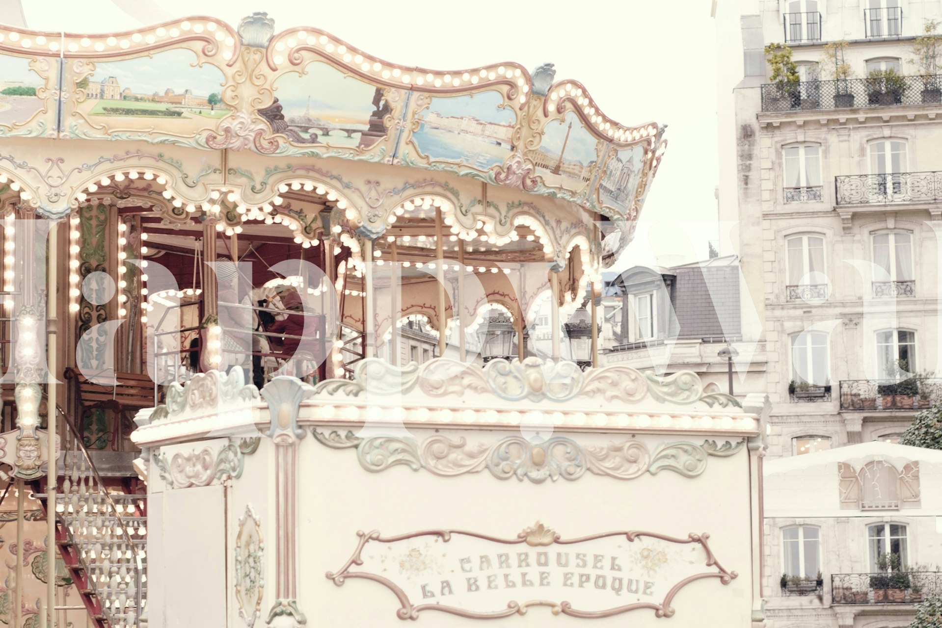 Vintage carousel scene with pastel decor and lights wallpaper