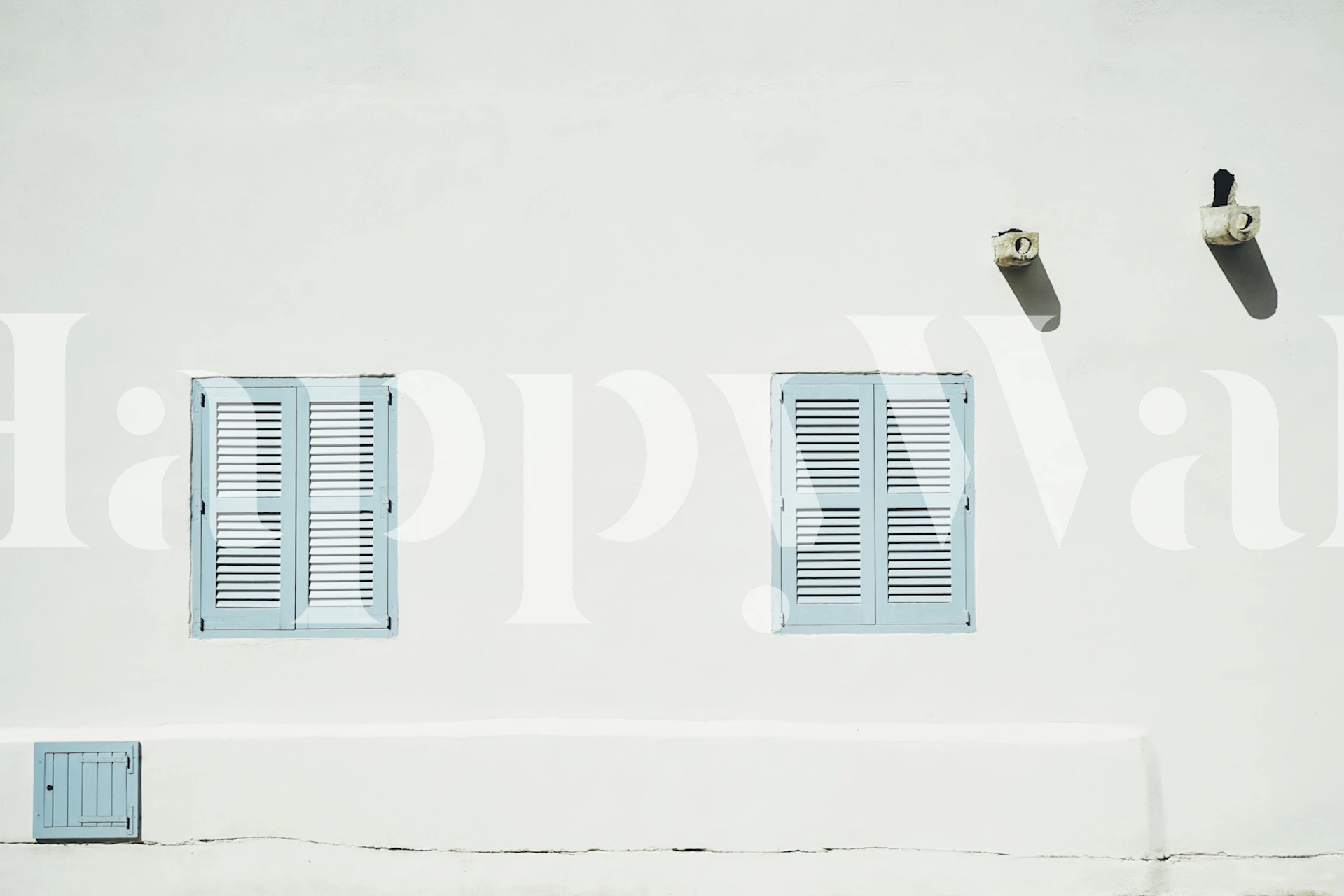 White wall with blue shutters and ventilation in a clean Mediterranean style wallpaper