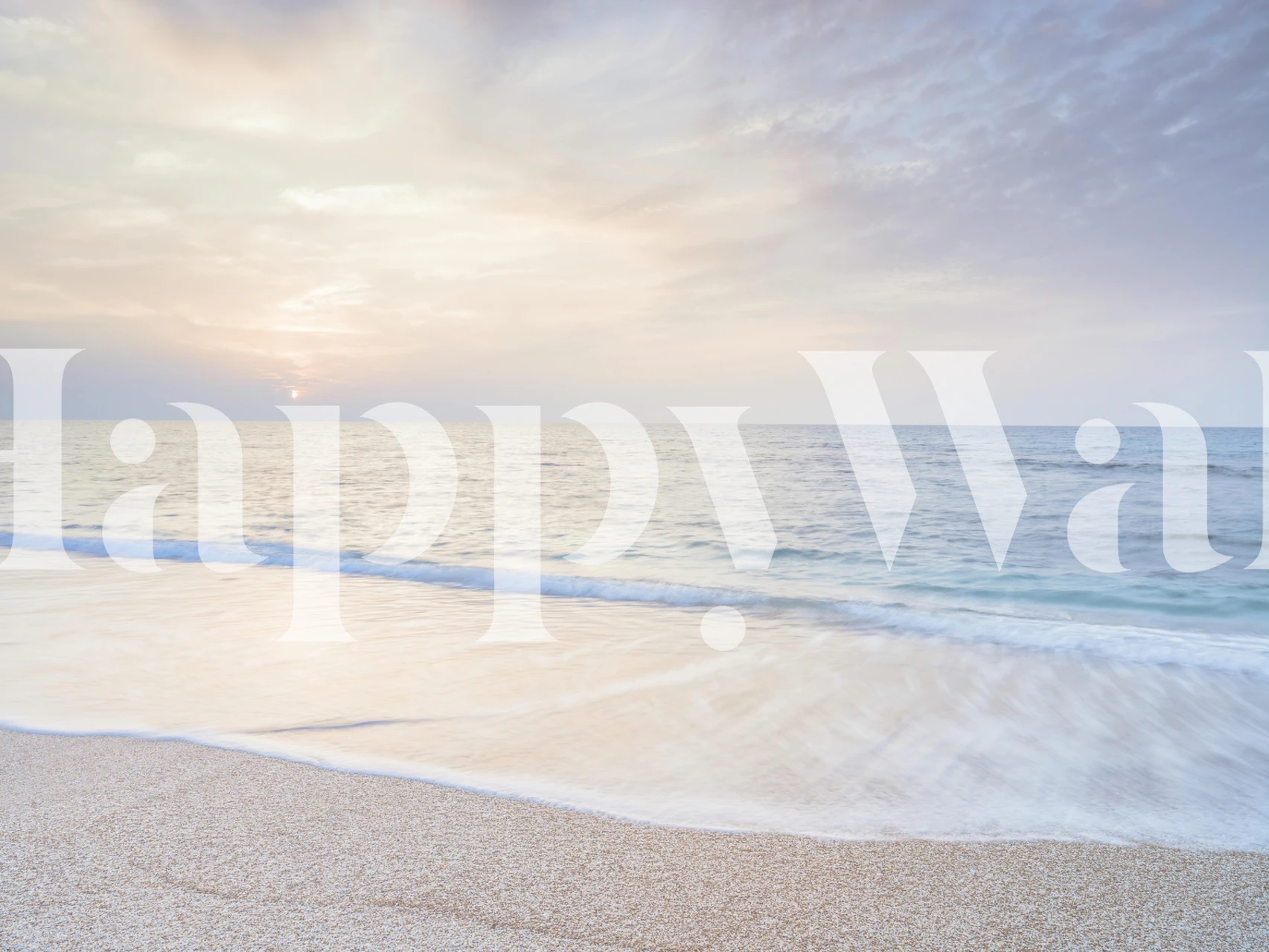 Wall mural of a serene beach at sunset with gentle waves and a soft-hued sky.