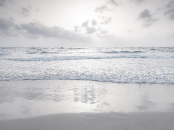 Tranquil beach with cloudscape