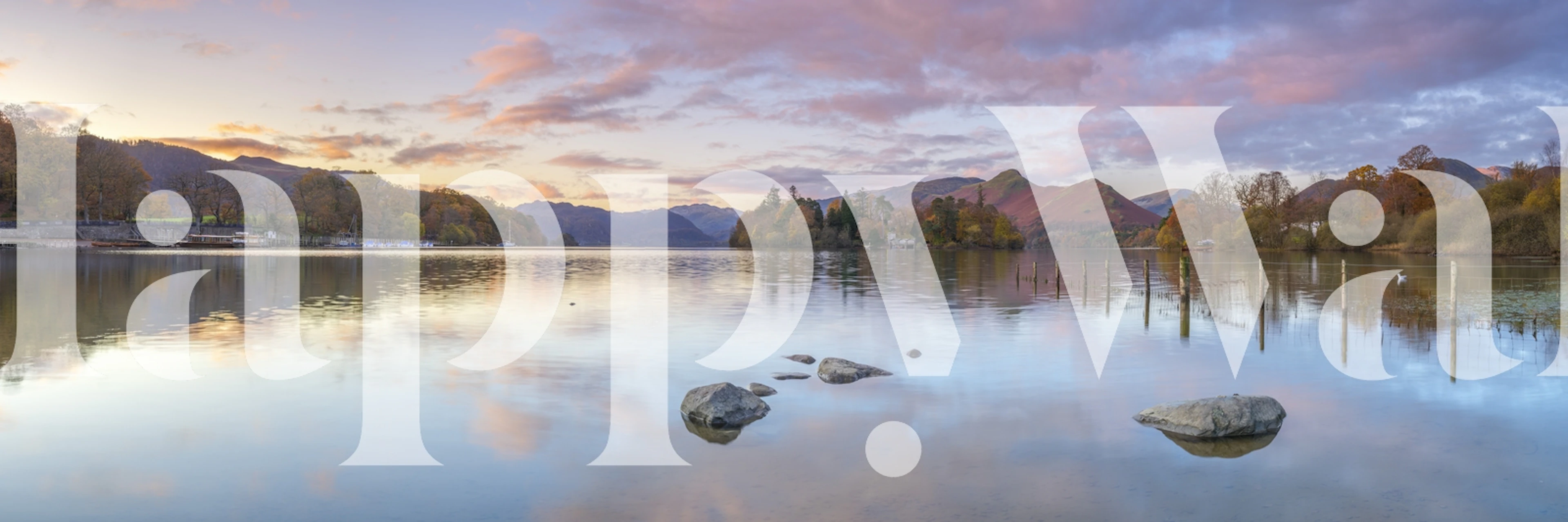 Landscape scene of lake surrounded by mountains and trees wallpaper