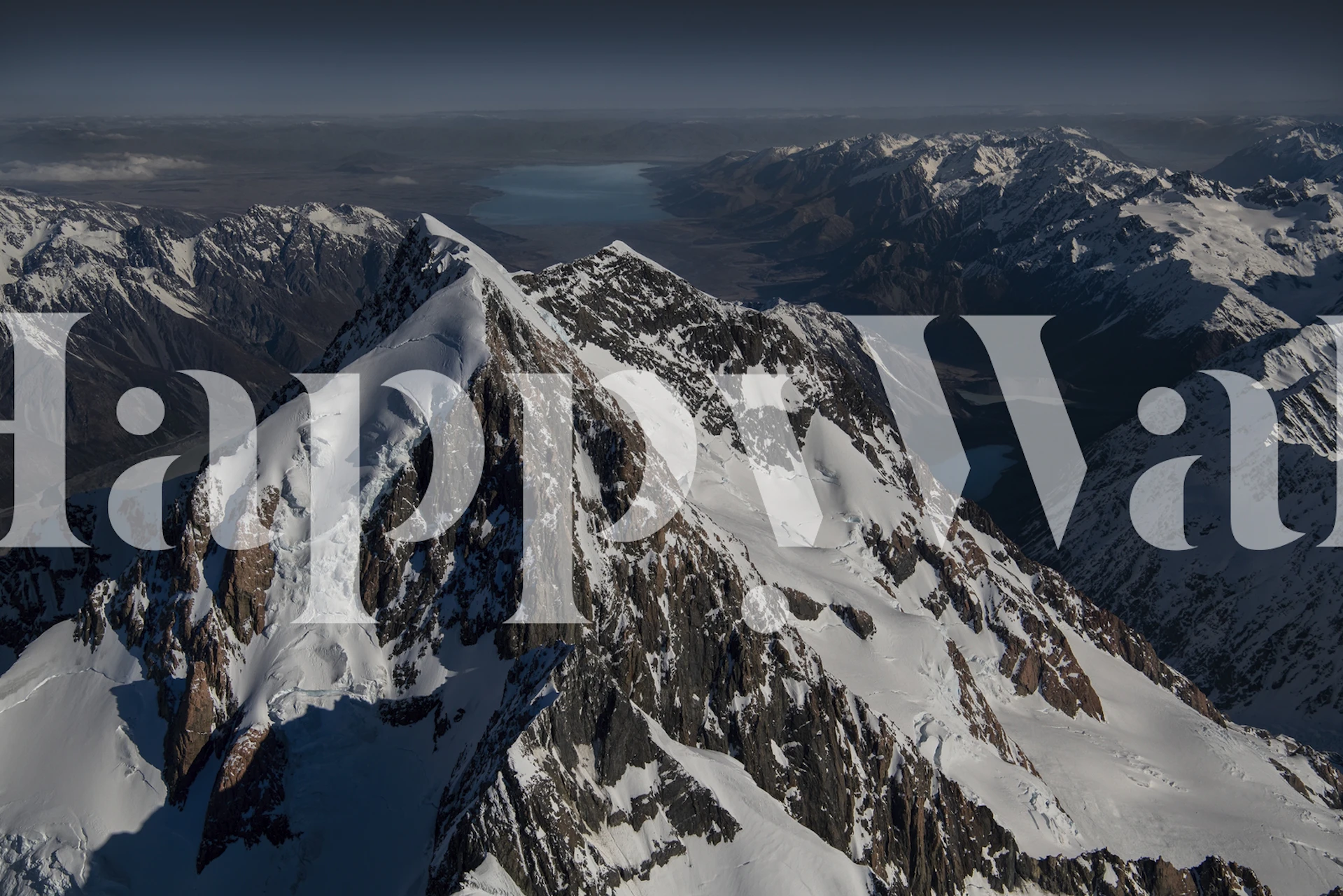 Snow-capped mountain peaks and valleys wallpaper
