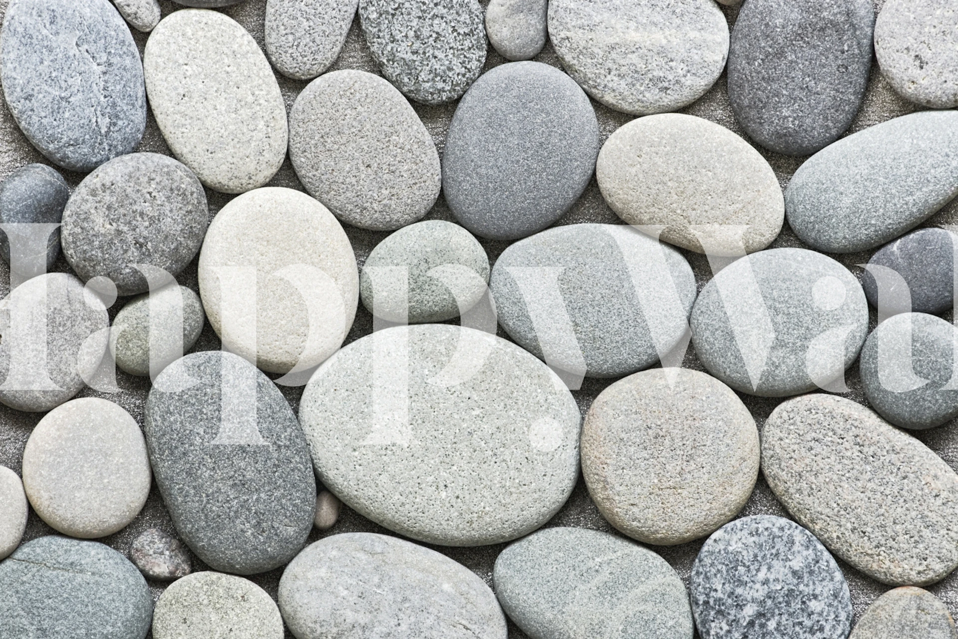 Grey pebble textured wallpaper with various stone shades.