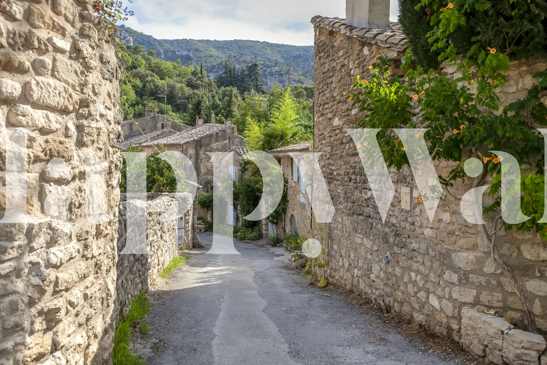 Rustic stone walls and greenery in Provence wallpaper