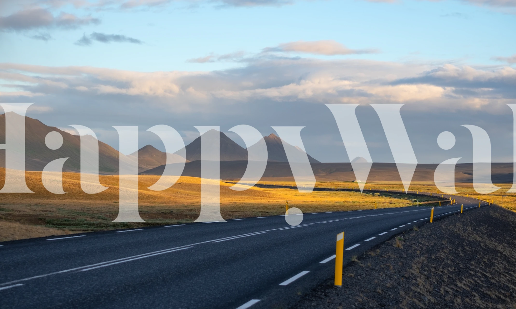 Iceland mountain road with grassy hills and cloudy sky wallpaper