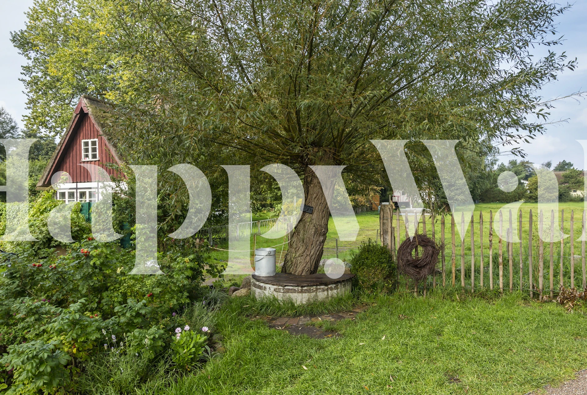Country garden wallpaper with an old fence