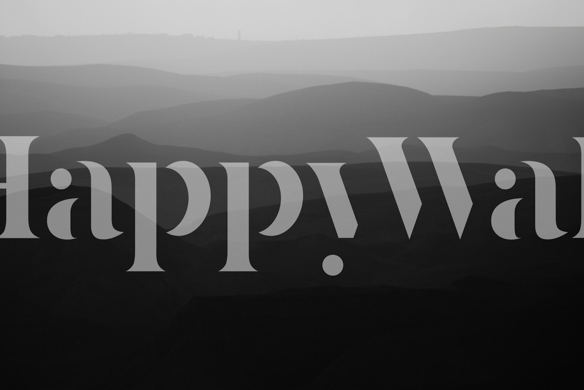 Svart og hvitt veggmaleri som viser de bølgende åsene i Judea-ørkenen