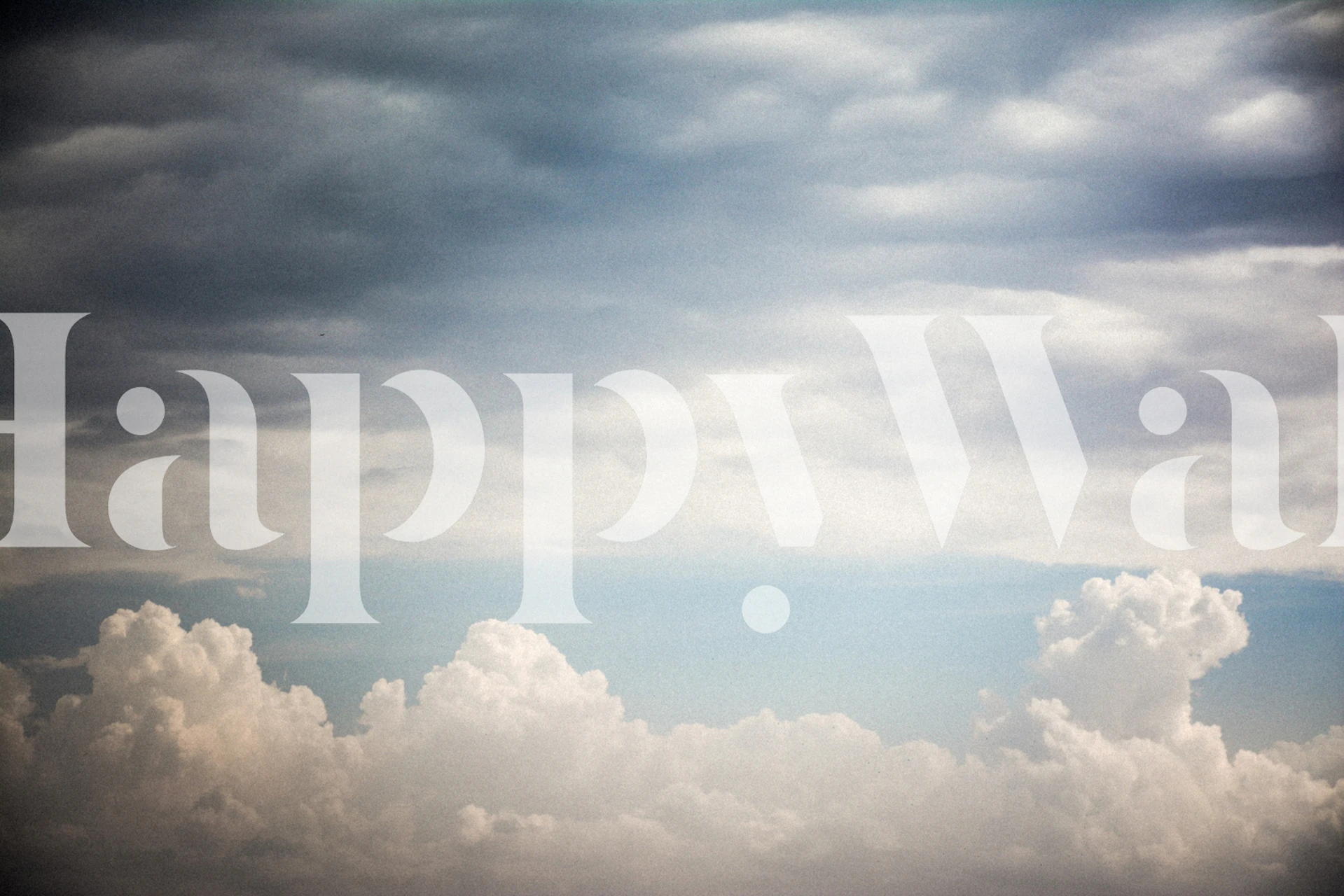 Clouds in various shades of blue and white wallpaper