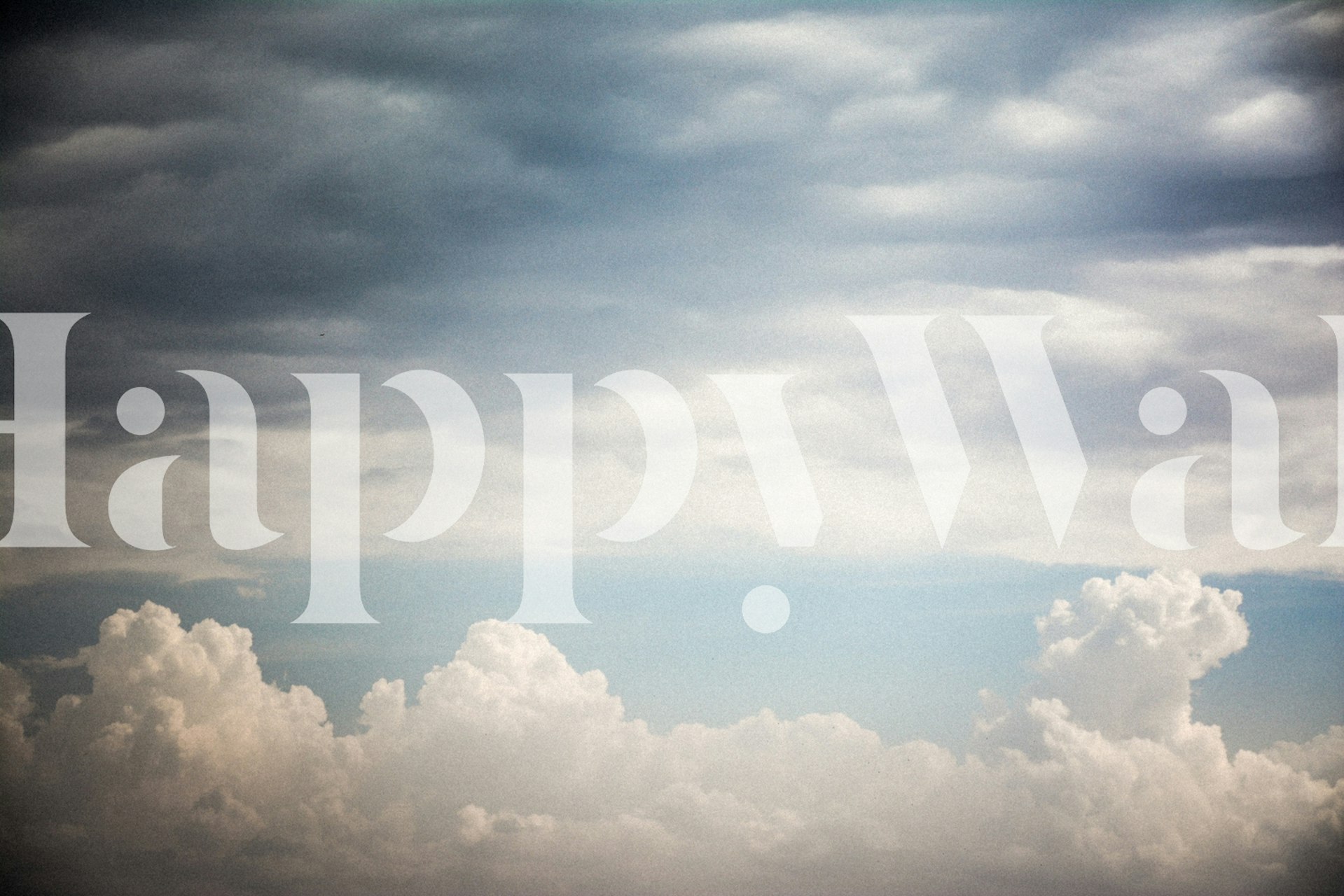 Clouds in various shades of blue and white wallpaper