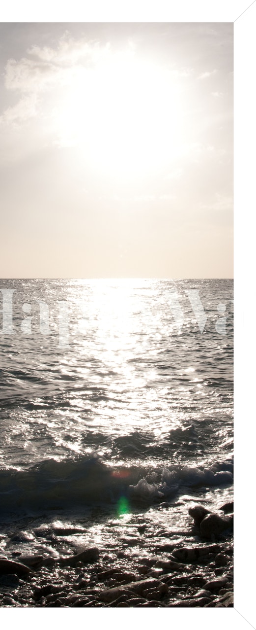 Tropical ocean sunset wall mural with sun reflecting on water