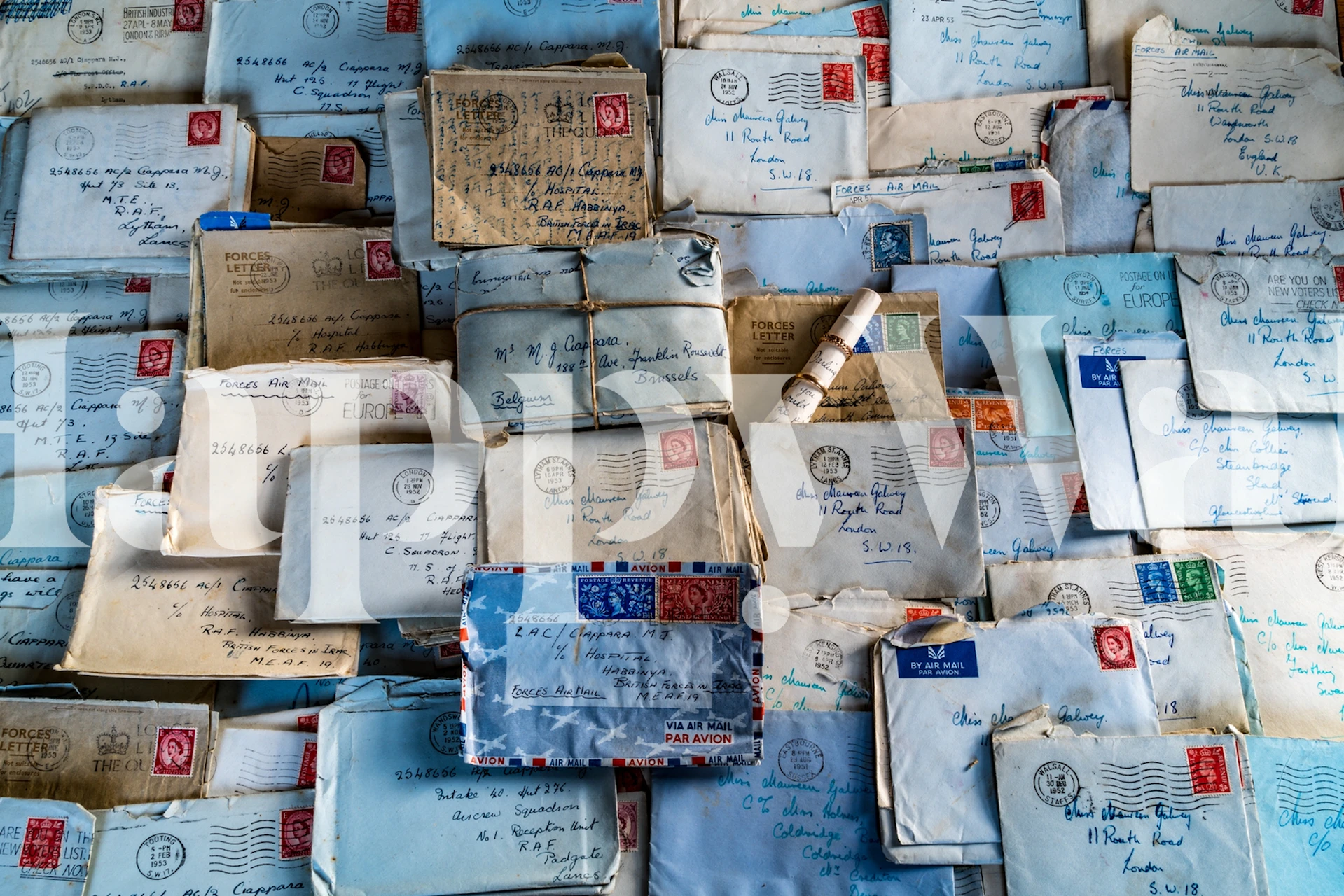 Vintage letter wallpaper with blue tones and various envelope designs