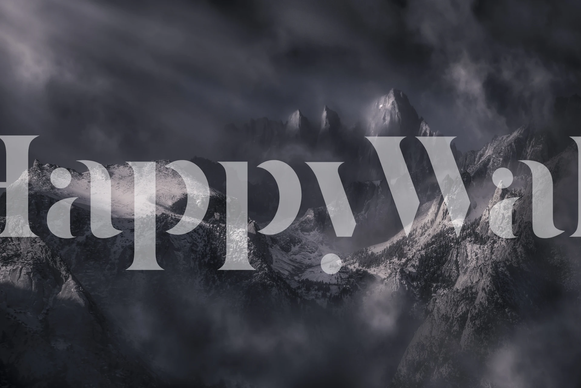 Dark mountain landscape with clouds and peaks wallpaper