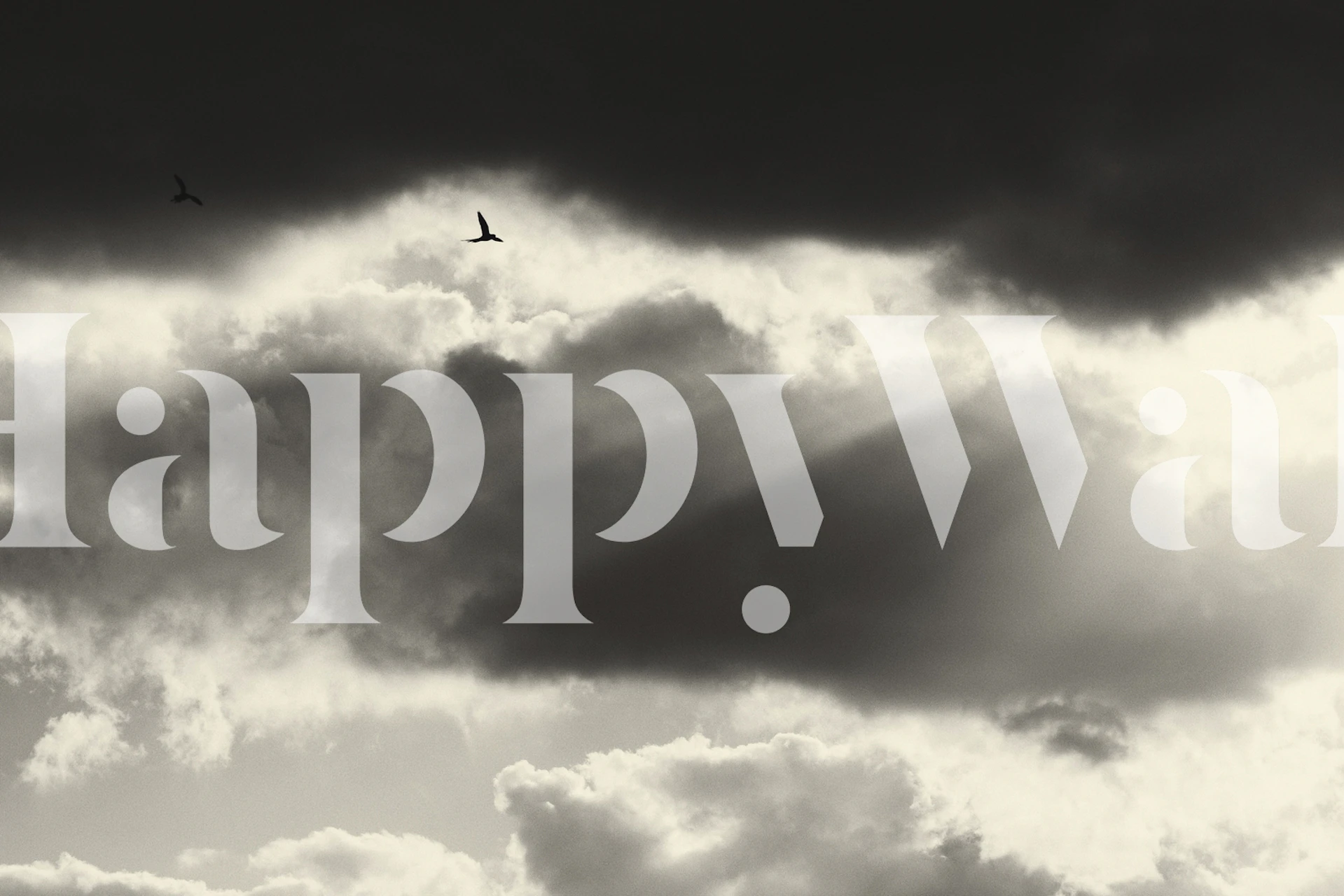 Cloudy sky with rays of light, black and white wallpaper