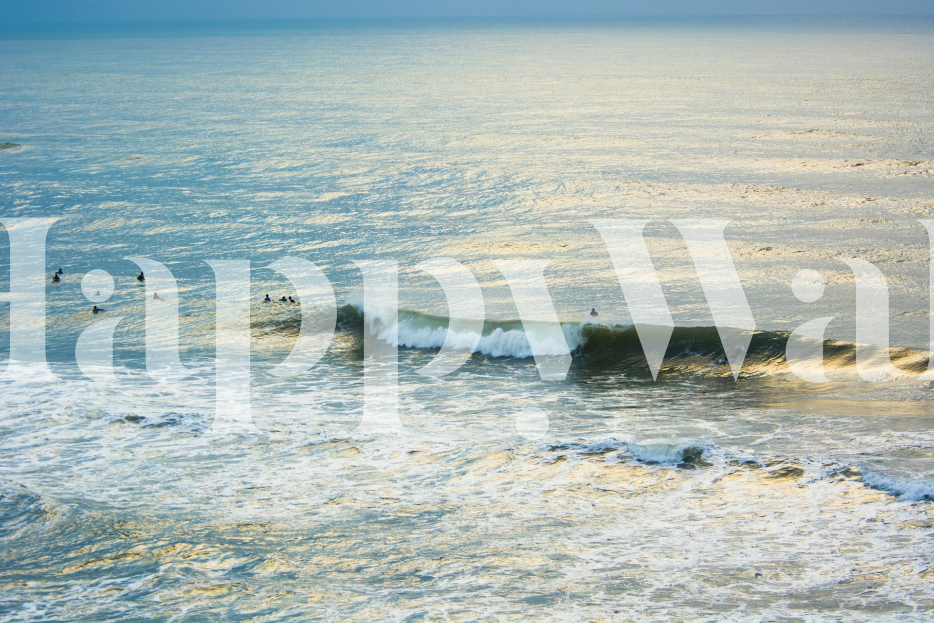 Ocean waves and surfers in blue tones wallpaper