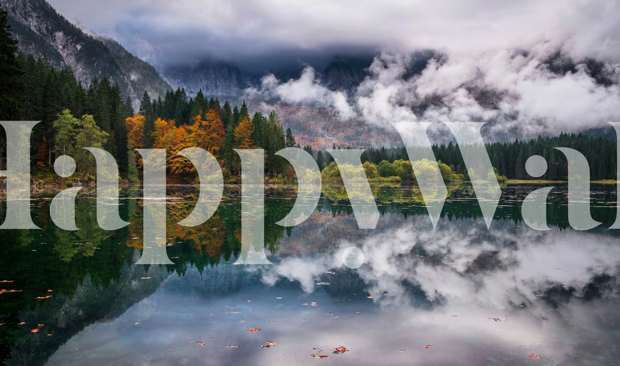 Fusine Lake wall mural showing autumn trees and mountains reflected in calm water