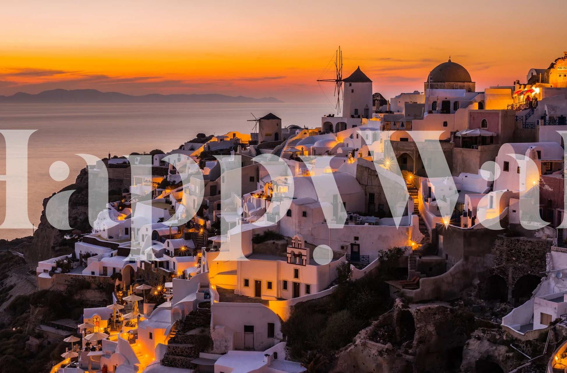 Zidna slika zalaska sunca na Santoriniju s bijelim zgradama i plavim kupolama