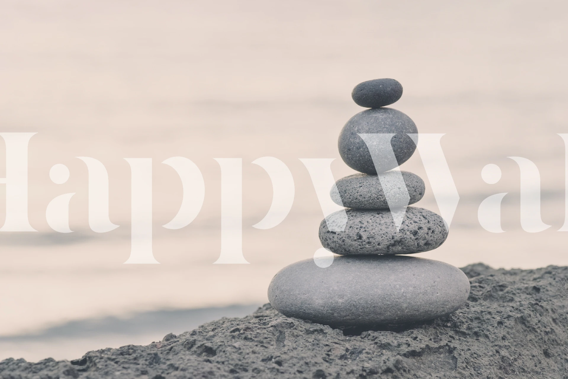 Fototapeta Zen stone cairn na klidné pláži za soumraku