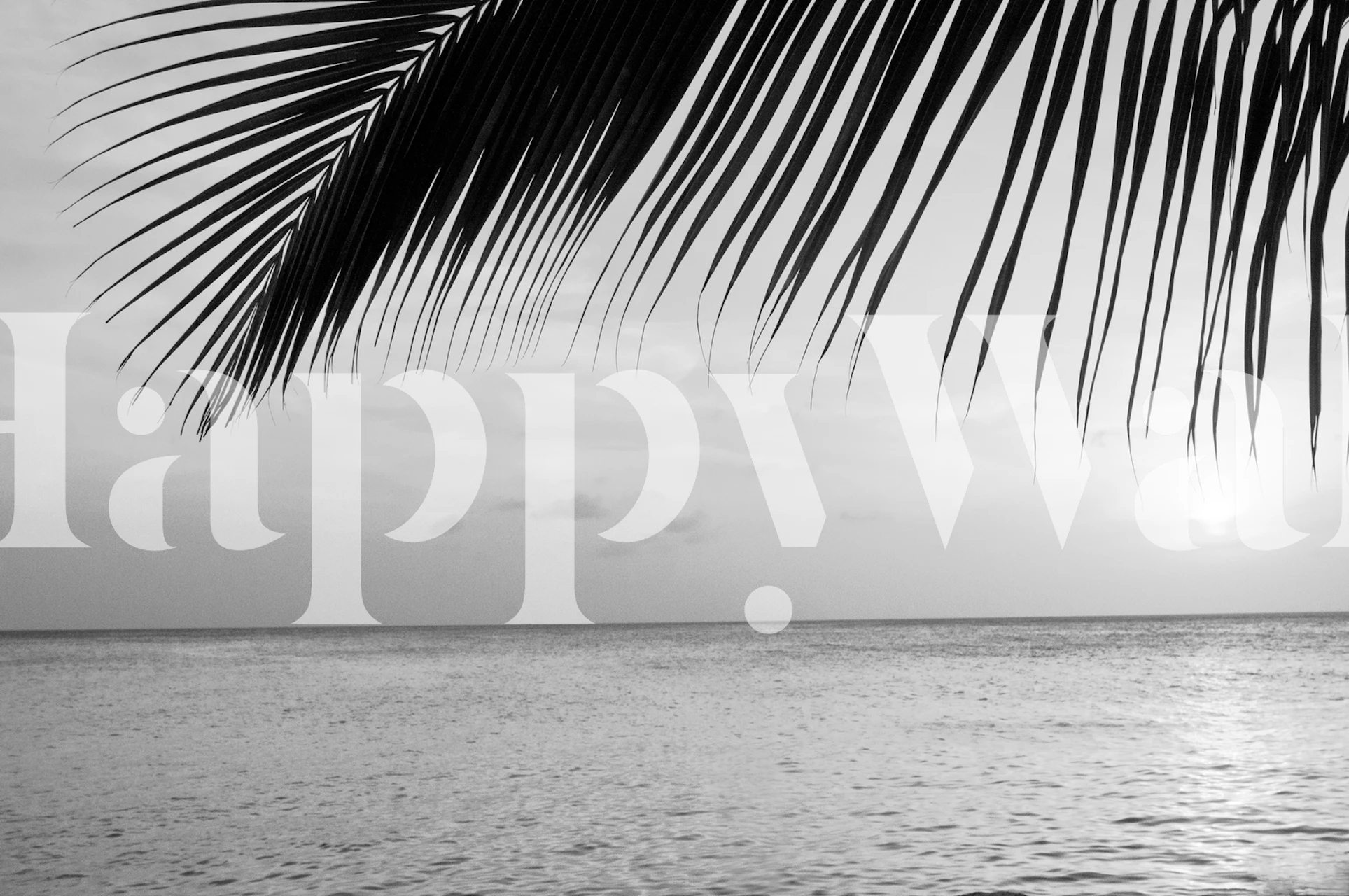 Black and white tropical palm leaves over a tranquil ocean wallpaper