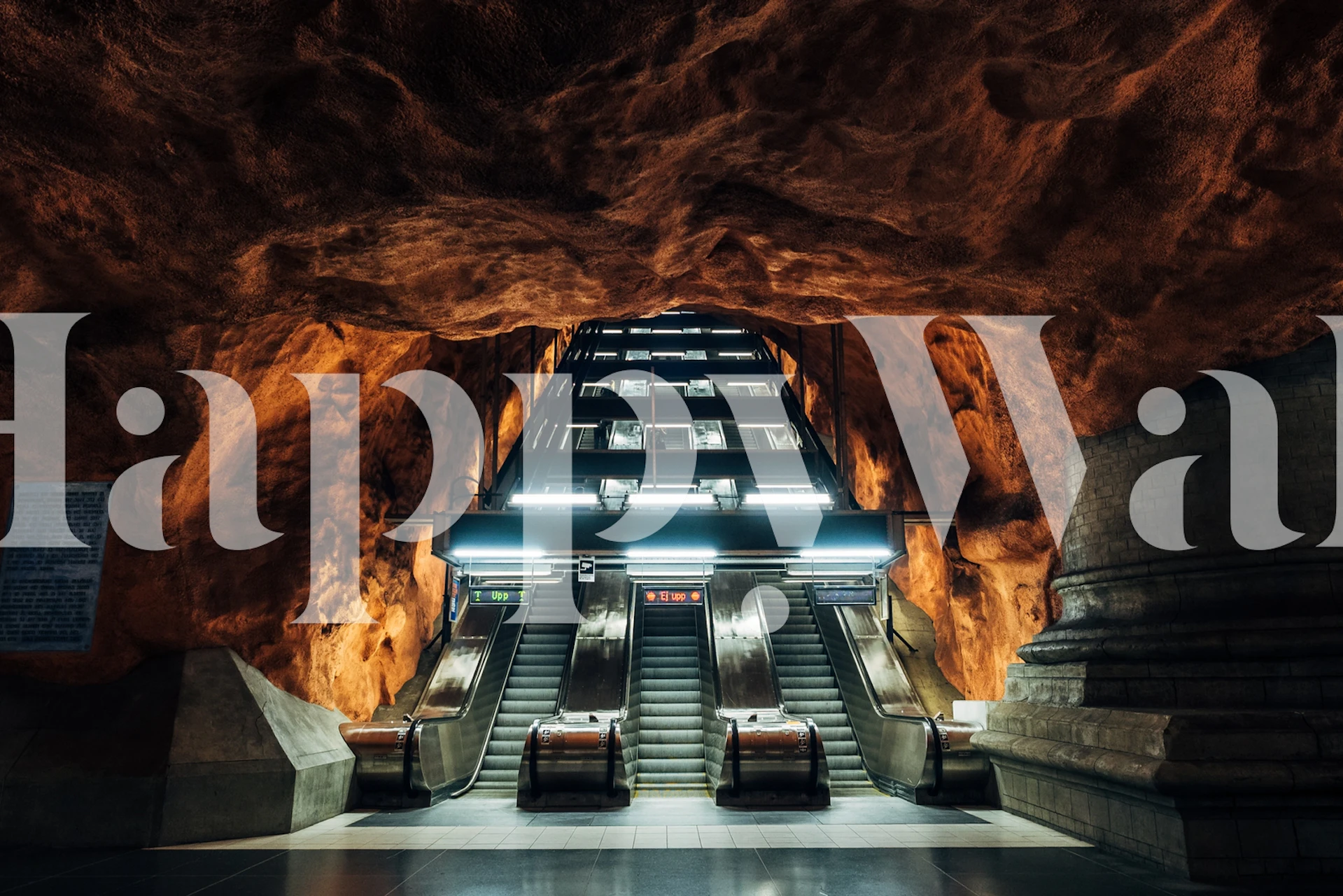 Subway escalators with rocky orange walls wallpaper