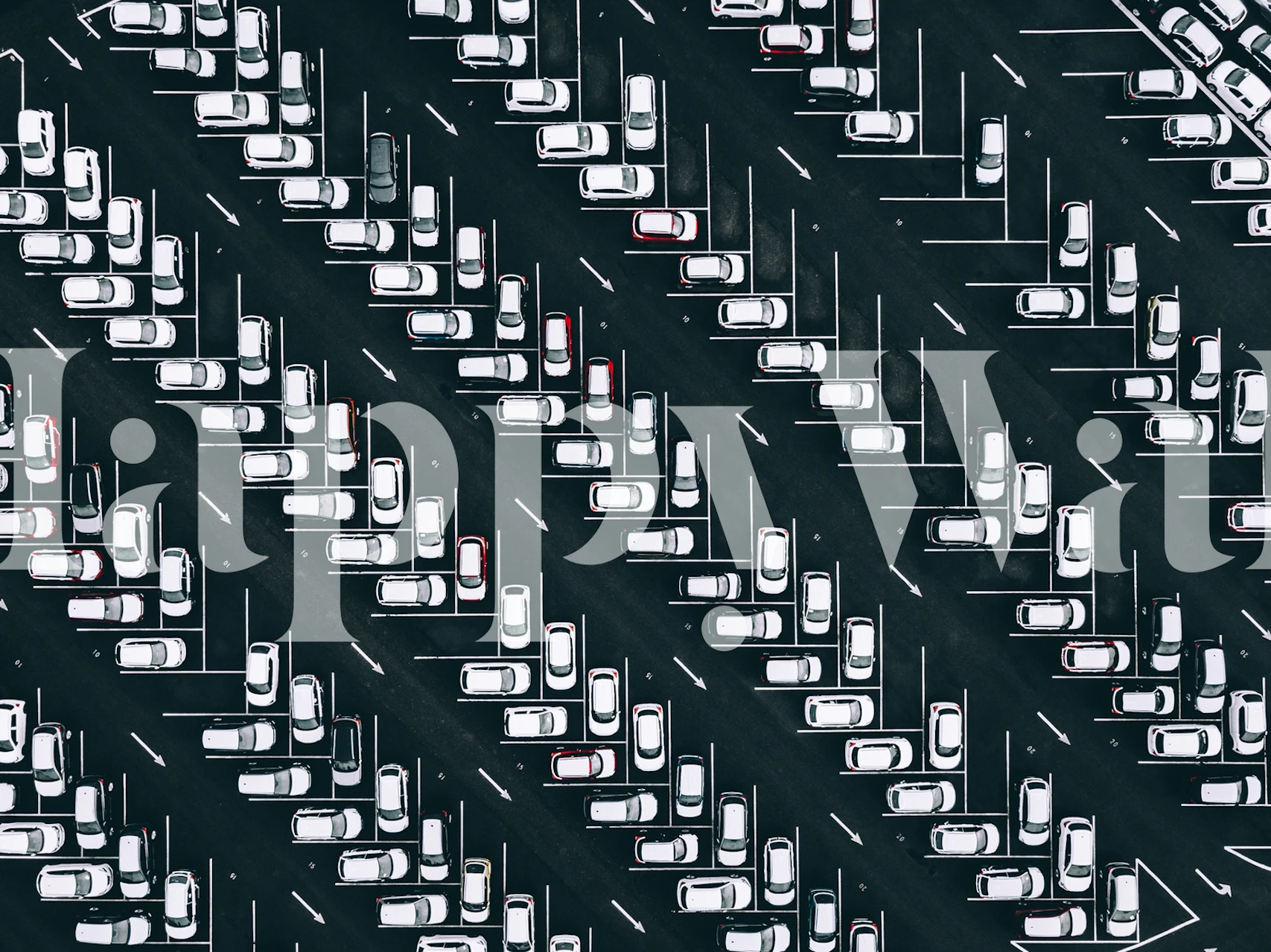 Aerial view of parked cars in a black and white patterned layout wallpaper