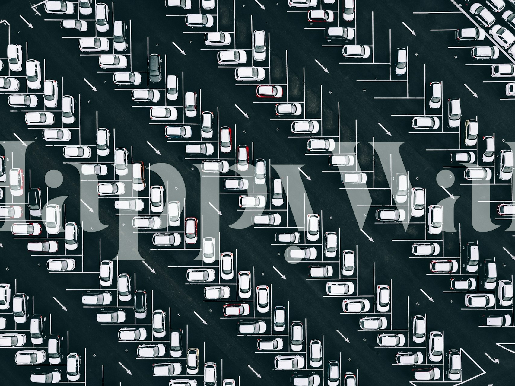 Aerial view of parked cars in a black and white patterned layout wallpaper