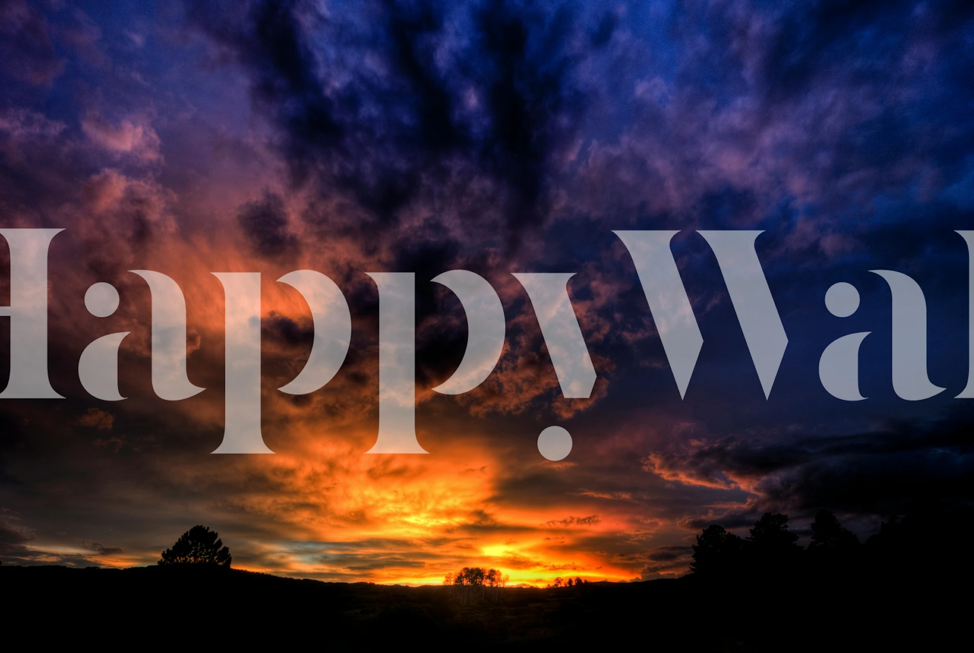 Sunset clouds in vibrant orange, purple, and black wallpaper