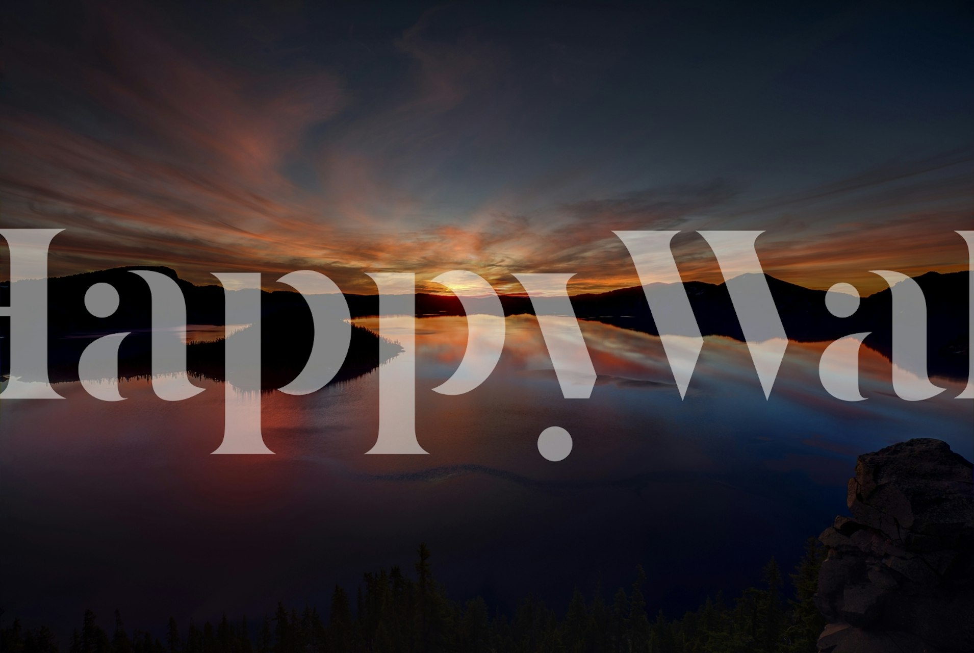 Dramatic sunset over a tranquil lake with mountain silhouettes wallpaper