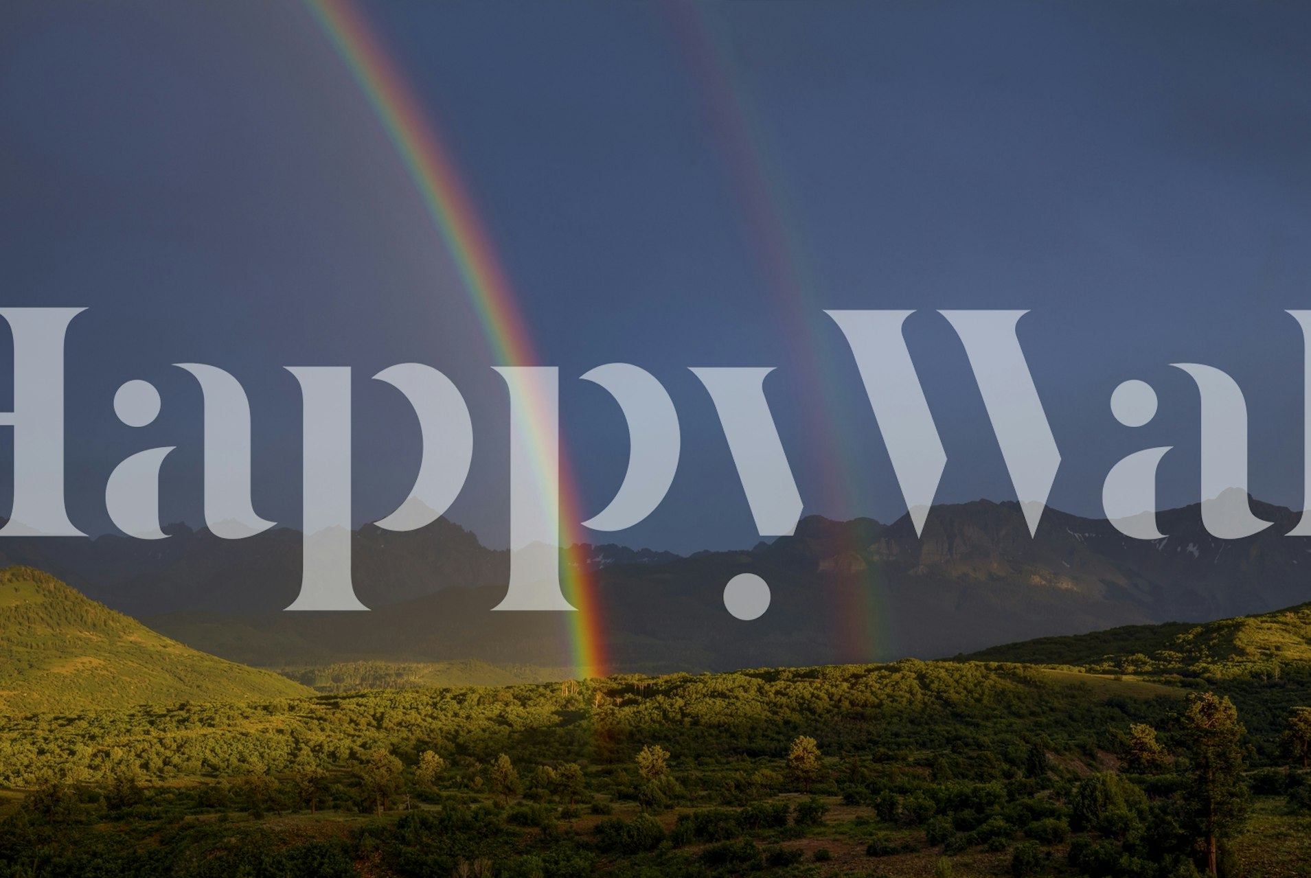 Double rainbow over green mountains and dark sky wallpaper