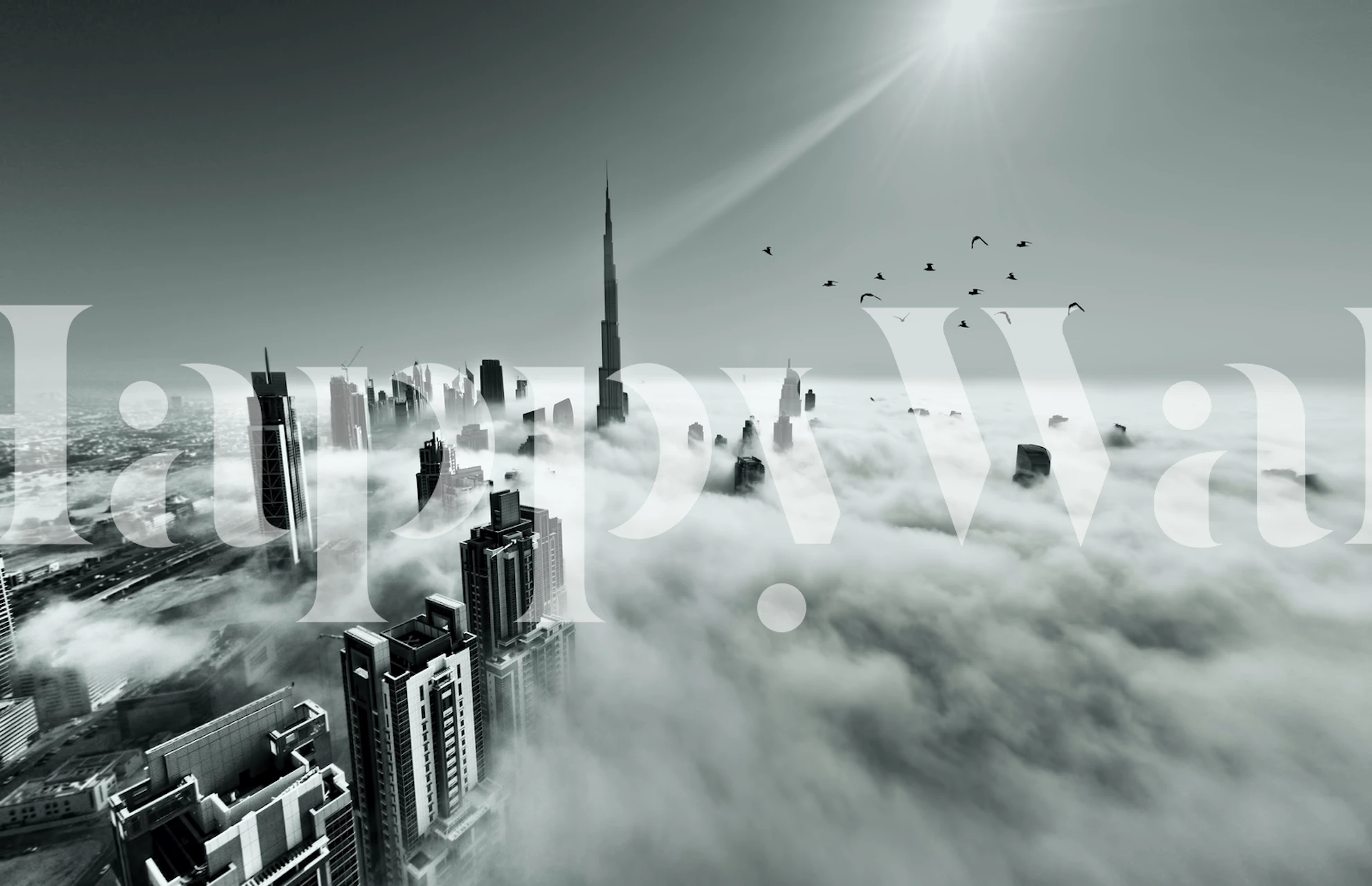 Tapet med en bybilde over skyer