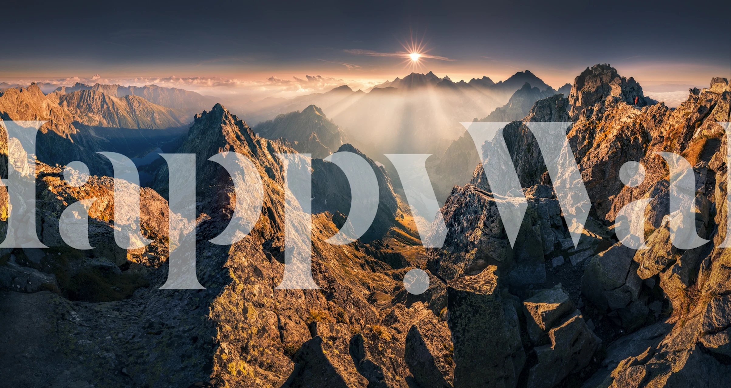 Mountain landscape at sunset with golden hues wallpaper