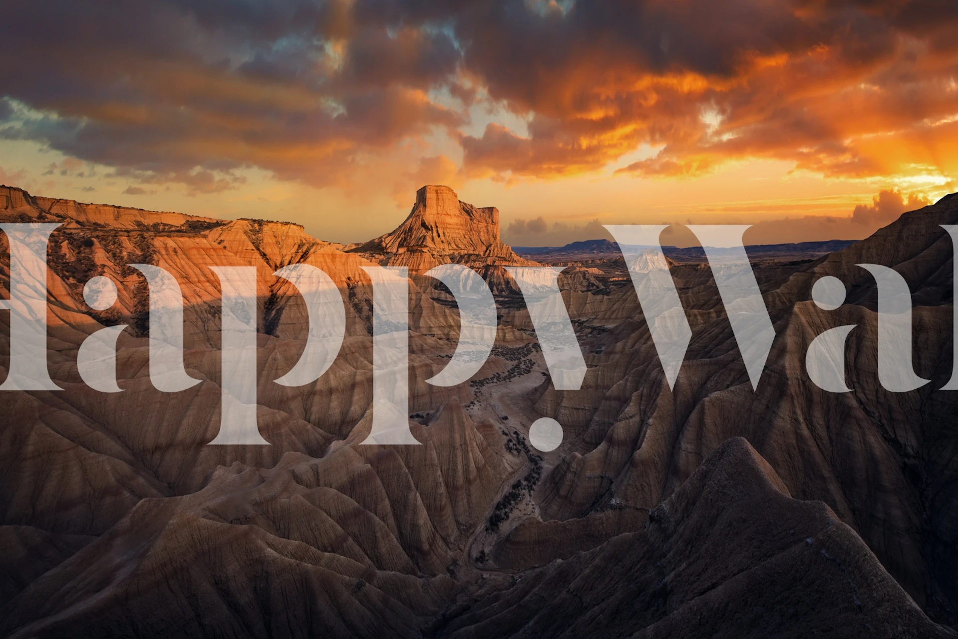 Layered Badlands landscape in browns and tans wallpaper