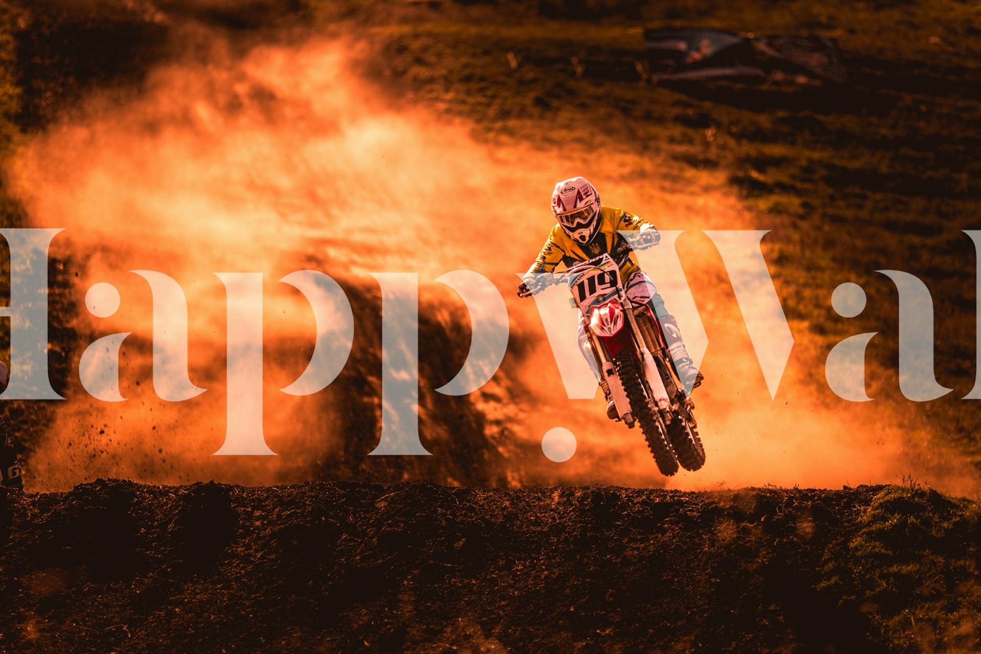 Motocross rider jumping in orange dust landscape wallpaper