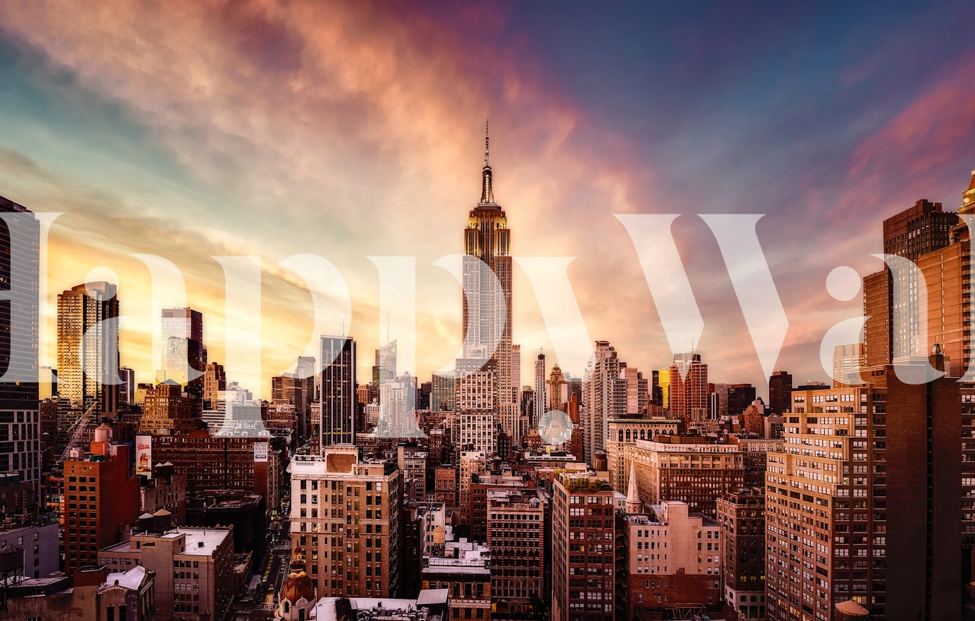 Papier peint mural Midtown Sunset représentant un horizon de la ville avec des teintes orange et roses dans le ciel